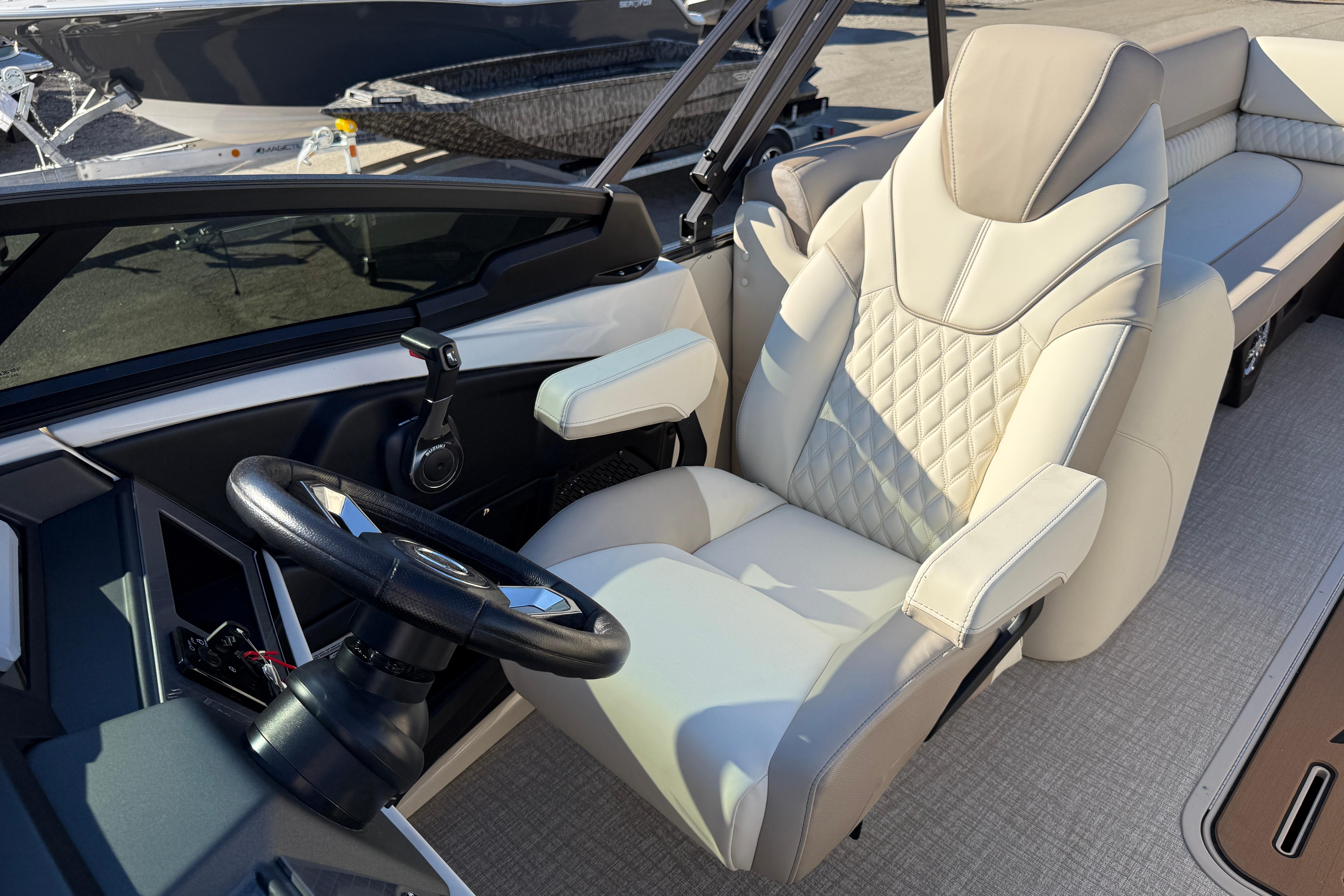 Luxurious interior of 2026 Tahoe Pontoon Cascade Quad Lounger Windshield with plush seating.