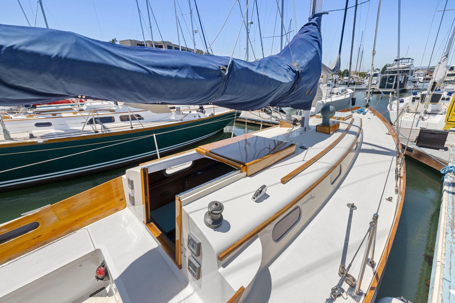 1964 Hinckley Pilot 35 sailboat docked in a marina, showcasing classic design and craftsmanship.