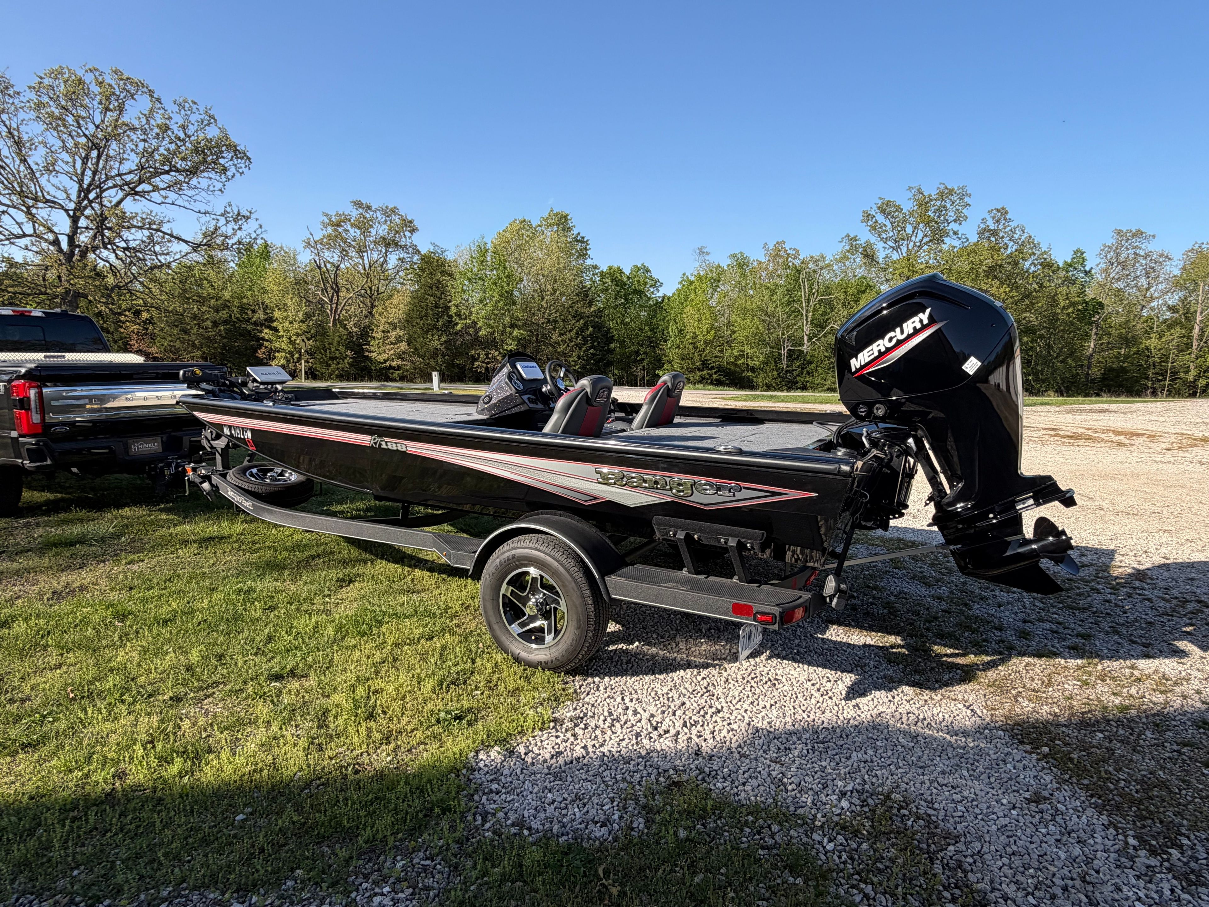2024 Ranger RT188 boat with Mercury engine on trailer outdoors.