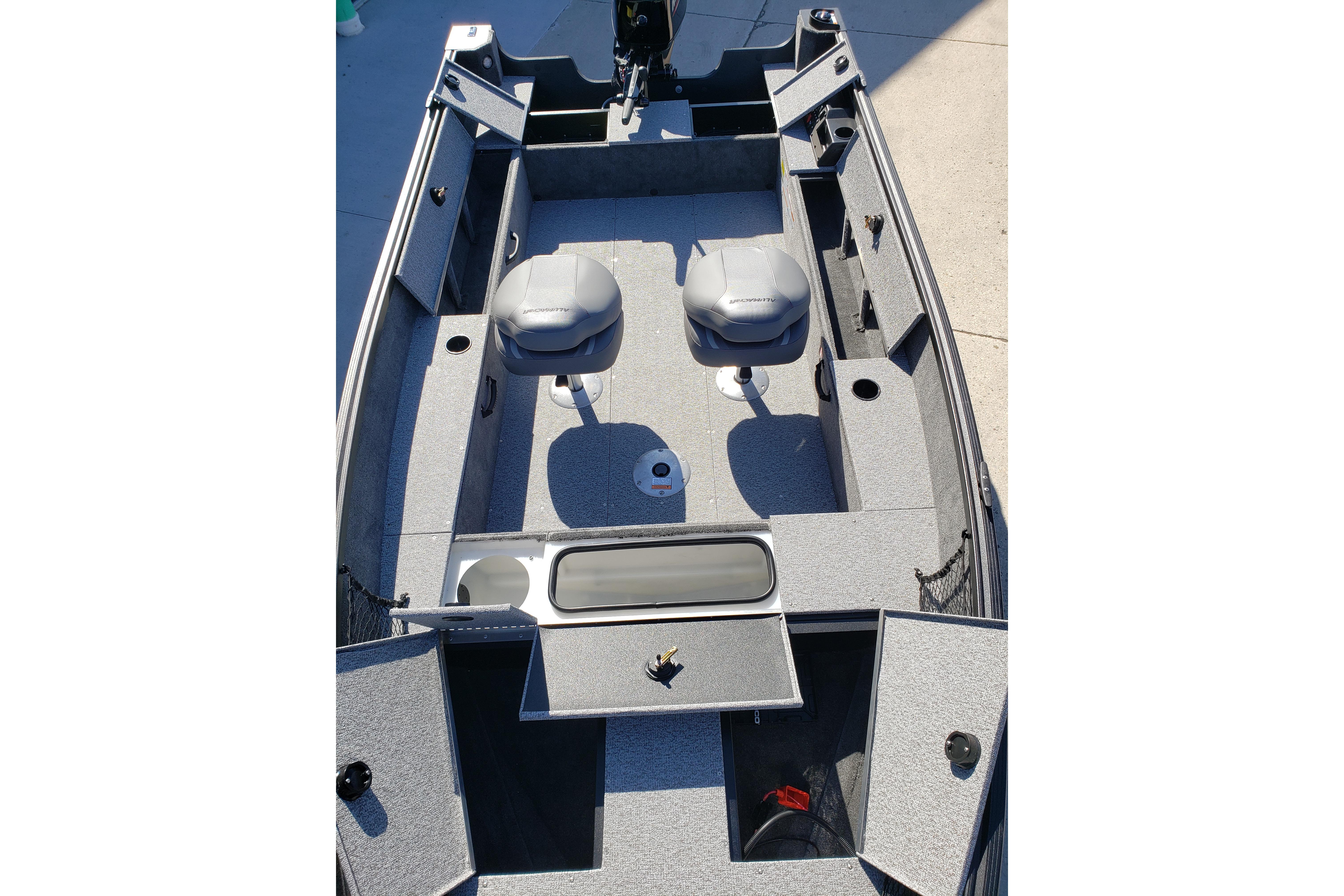 2026 Alumacraft Classic 165 Tiller boat interior with seating and storage compartments.