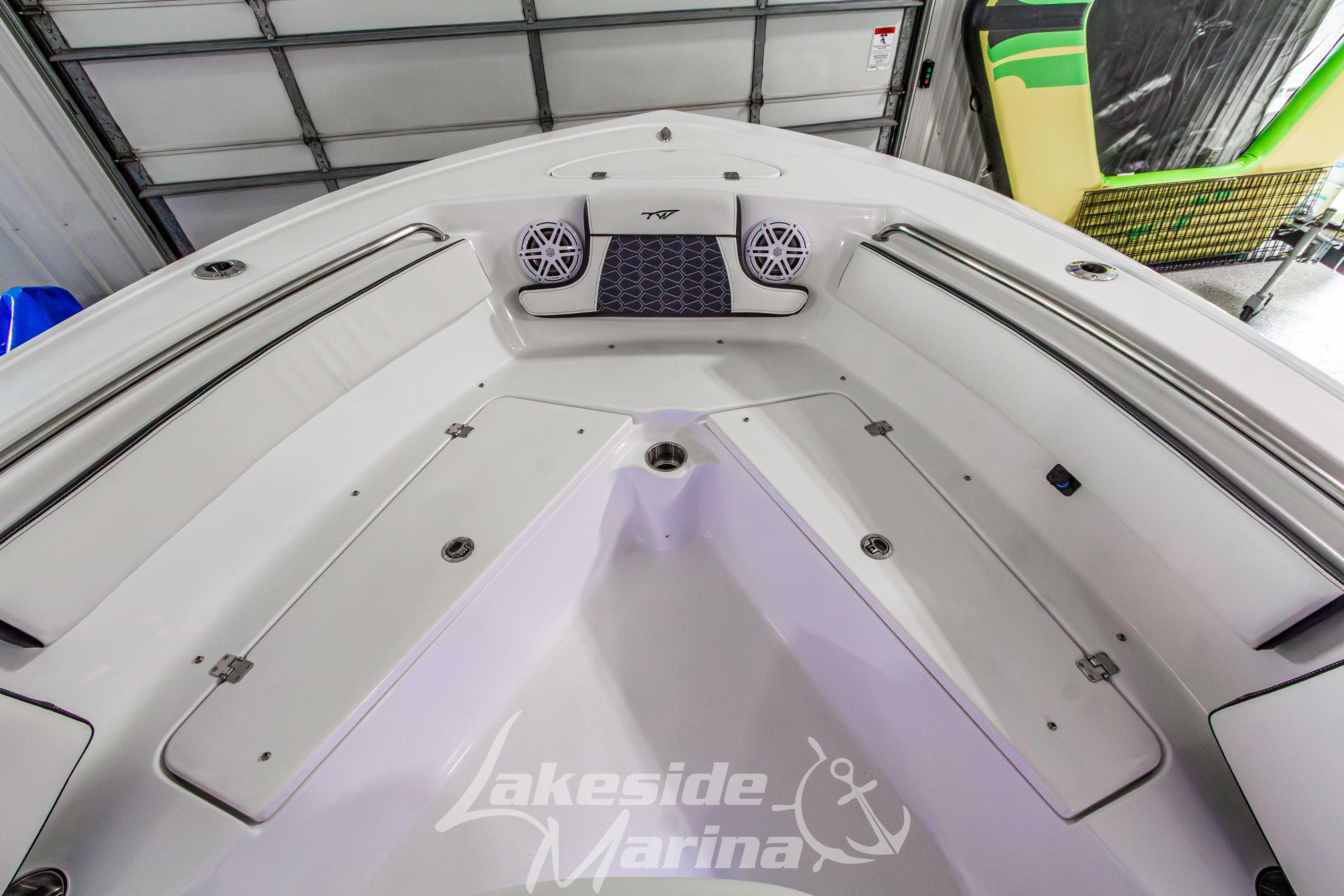 2026 Tidewater 210 CC Adventure boat interior with seating and storage compartments.