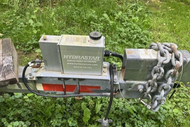 Trailer hitch with Hydrastar brake actuator on the trailer.