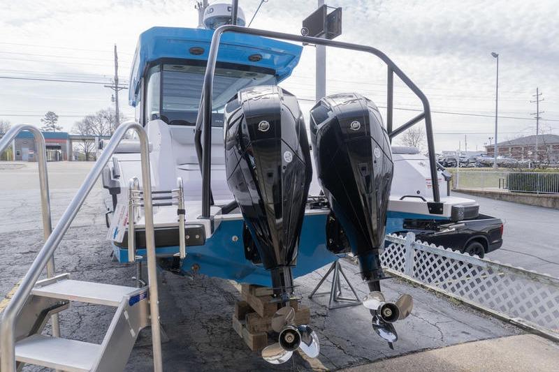 2025 Axopar 29 XC Cross Cabin with dual outboard motors on display.