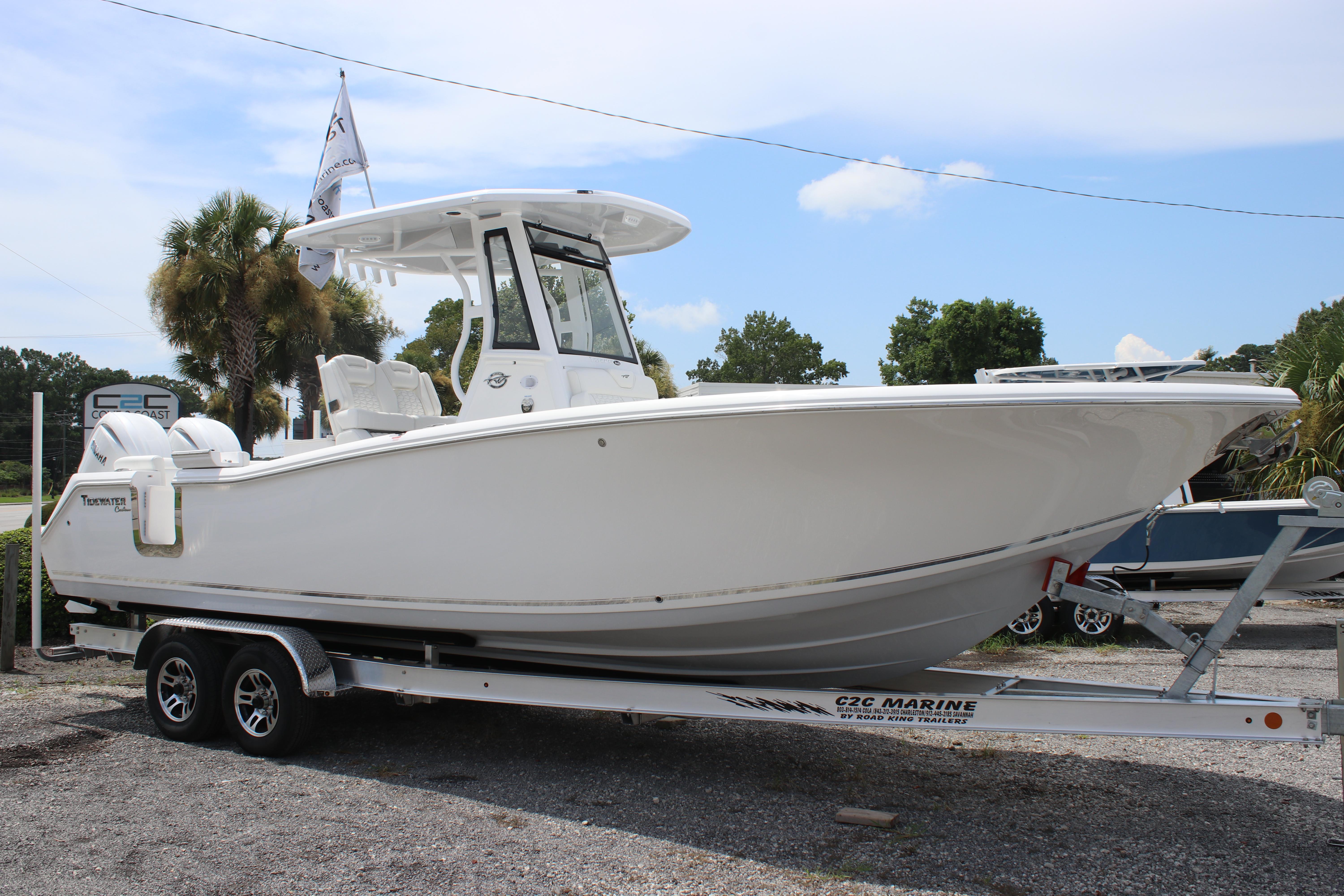 2026 Tidewater 272 LXF boat on trailer, parked outdoors under clear sky.