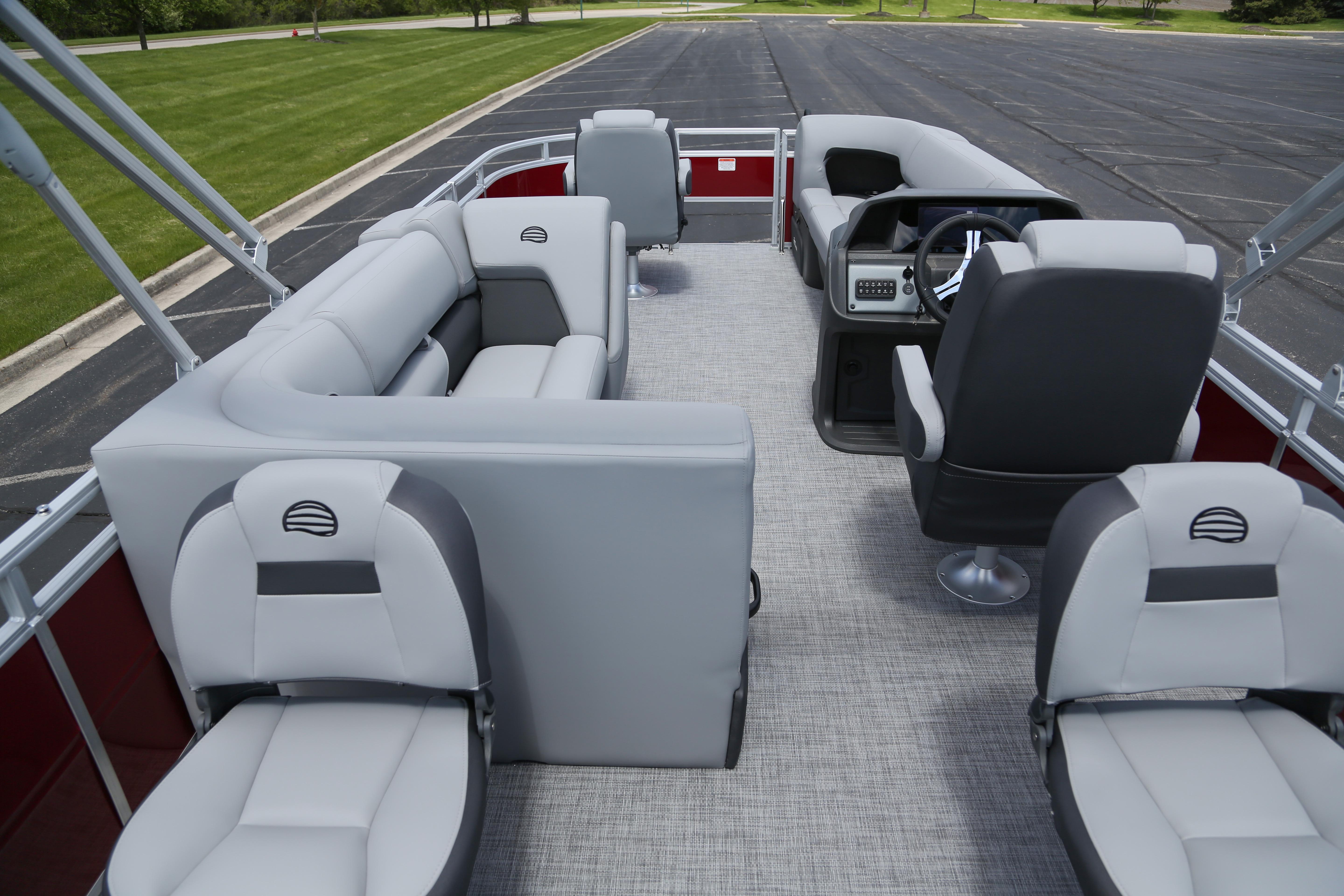 2026 Sun Tracker SportFish 20 DLX pontoon boat interior with plush seating and modern helm.