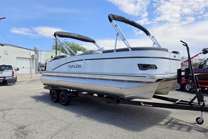 2026 Avalon Catalina Quad Lounge Shift pontoon boat on trailer, parked outdoors.
