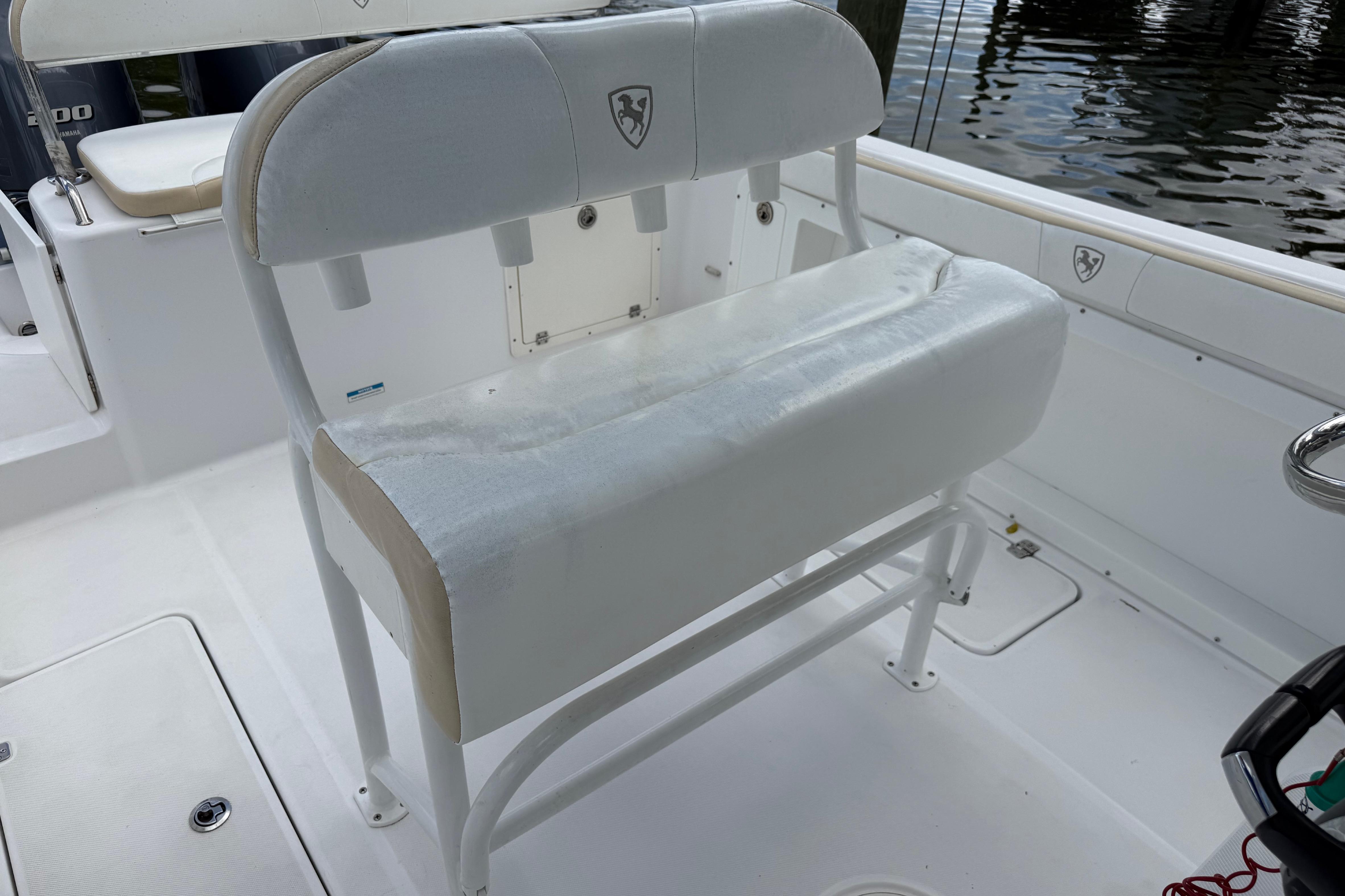 2022 Century 2600 Center Console boat seating area with white cushioned bench.