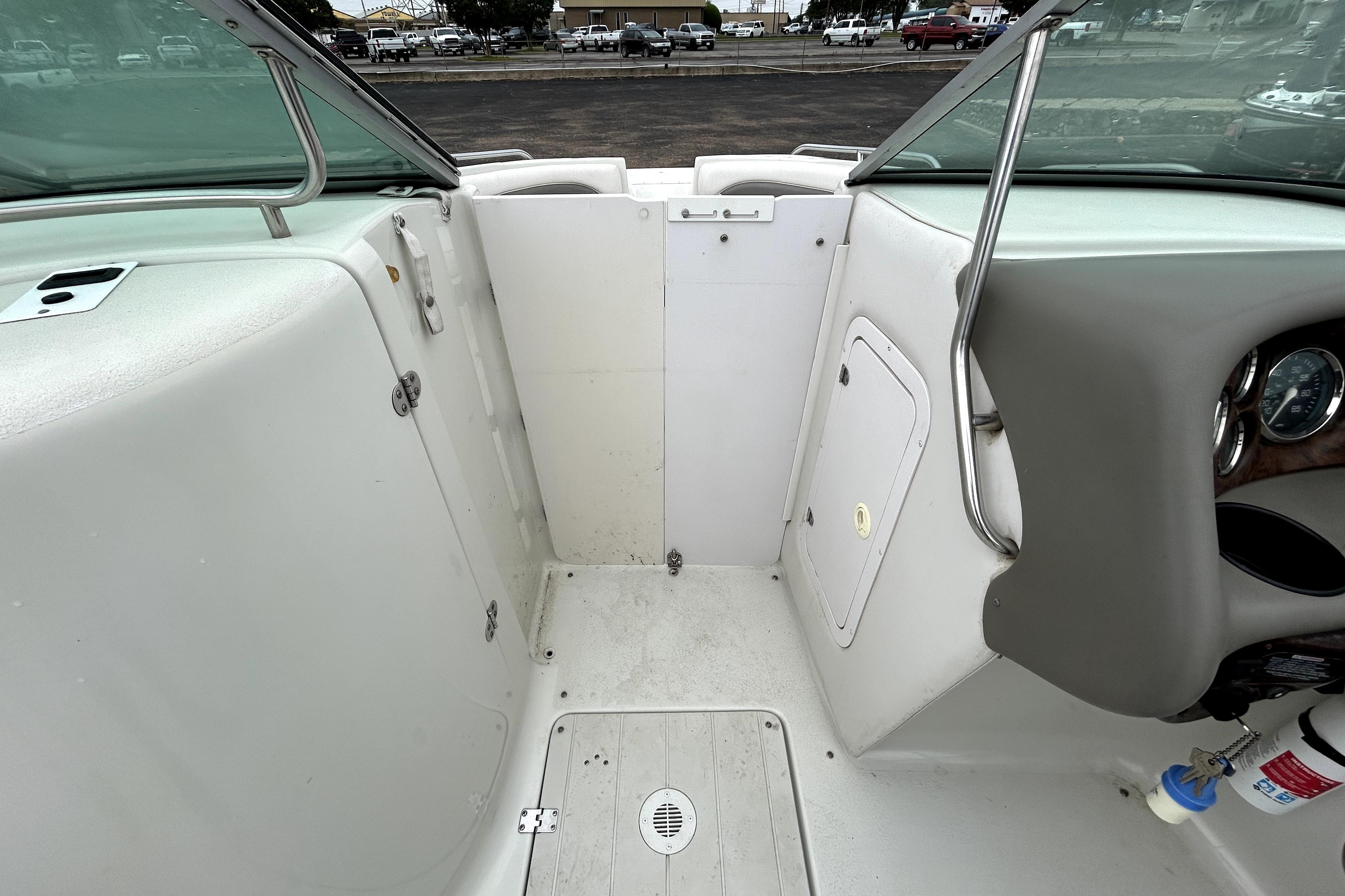Interior view of a 2001 Crownline 239 DB boat, featuring seating and dashboard.