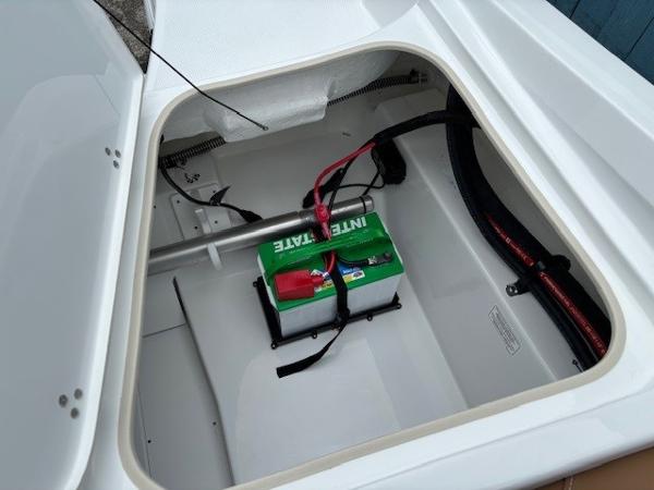 Battery compartment of 2025 Tahoe 185 S boat, featuring Interstate battery.