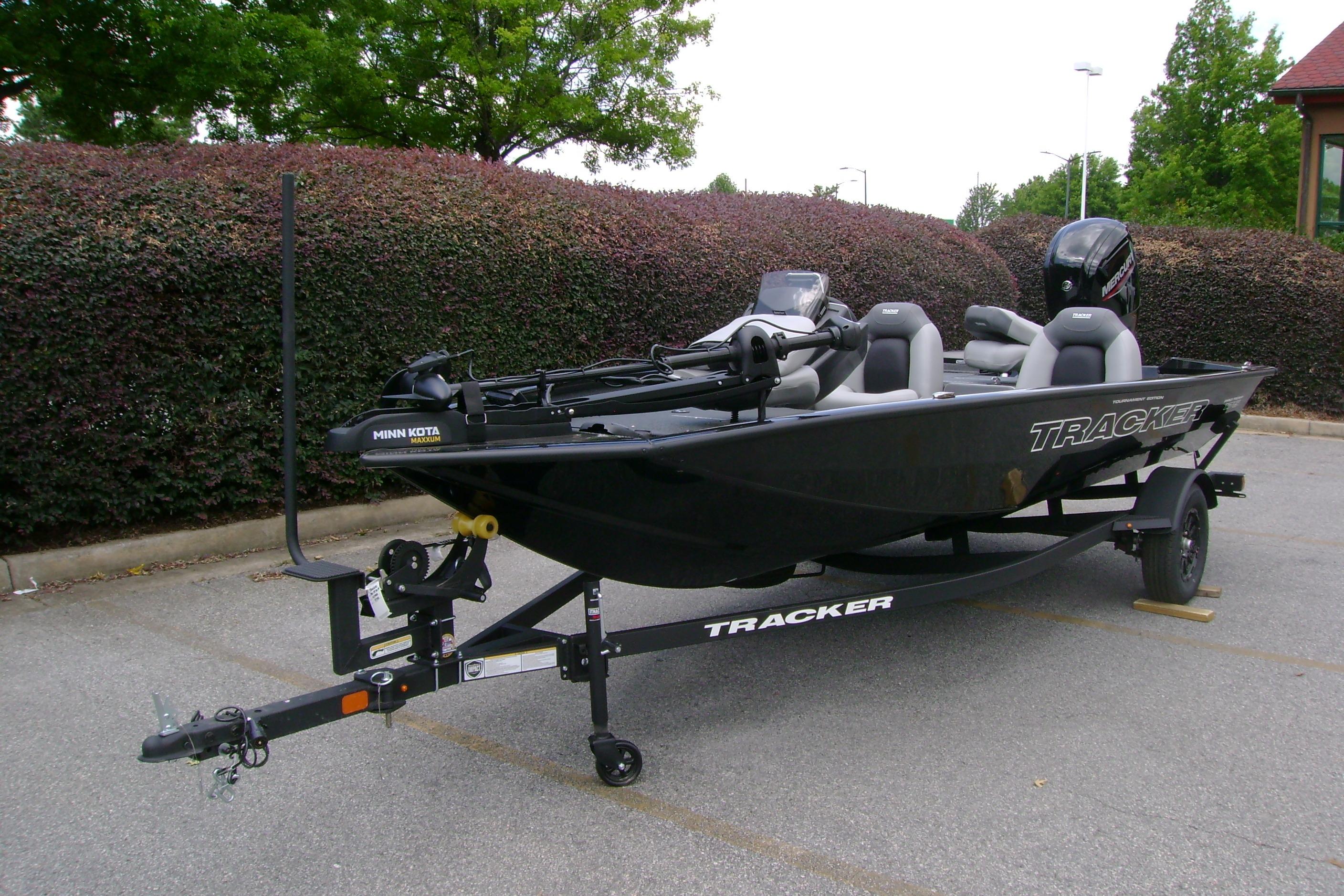 2026 Tracker Pro Team 175 boat on trailer in parking lot.