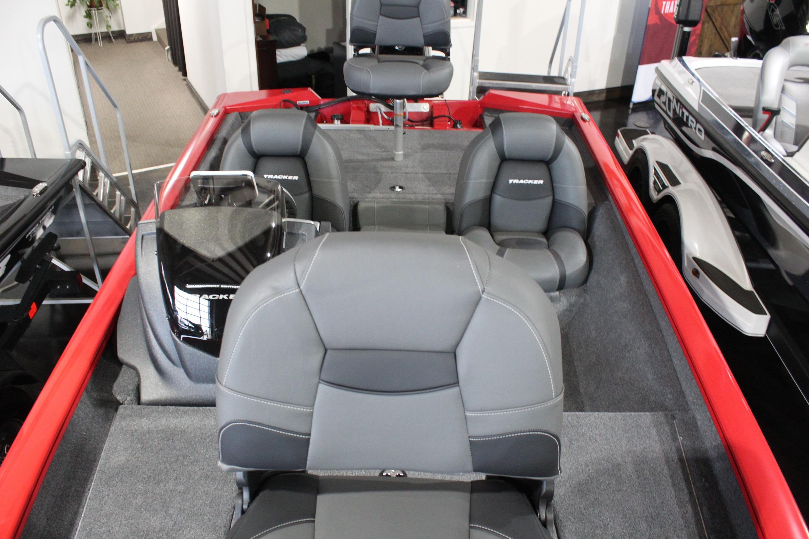 2026 Tracker Pro Team 175 boat interior with gray seating and red accents.