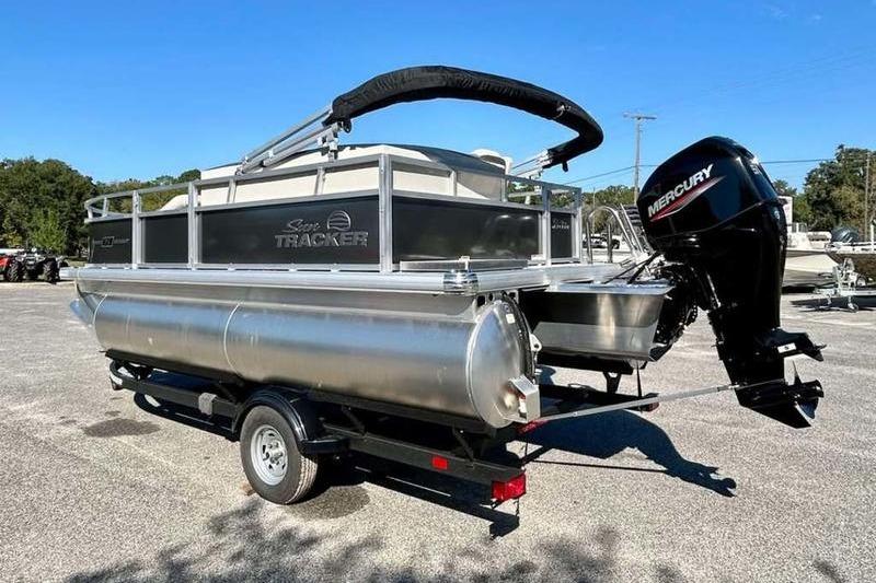 2026 Sun Tracker Bass Buggy 16 XL Select pontoon boat with Mercury outboard motor.