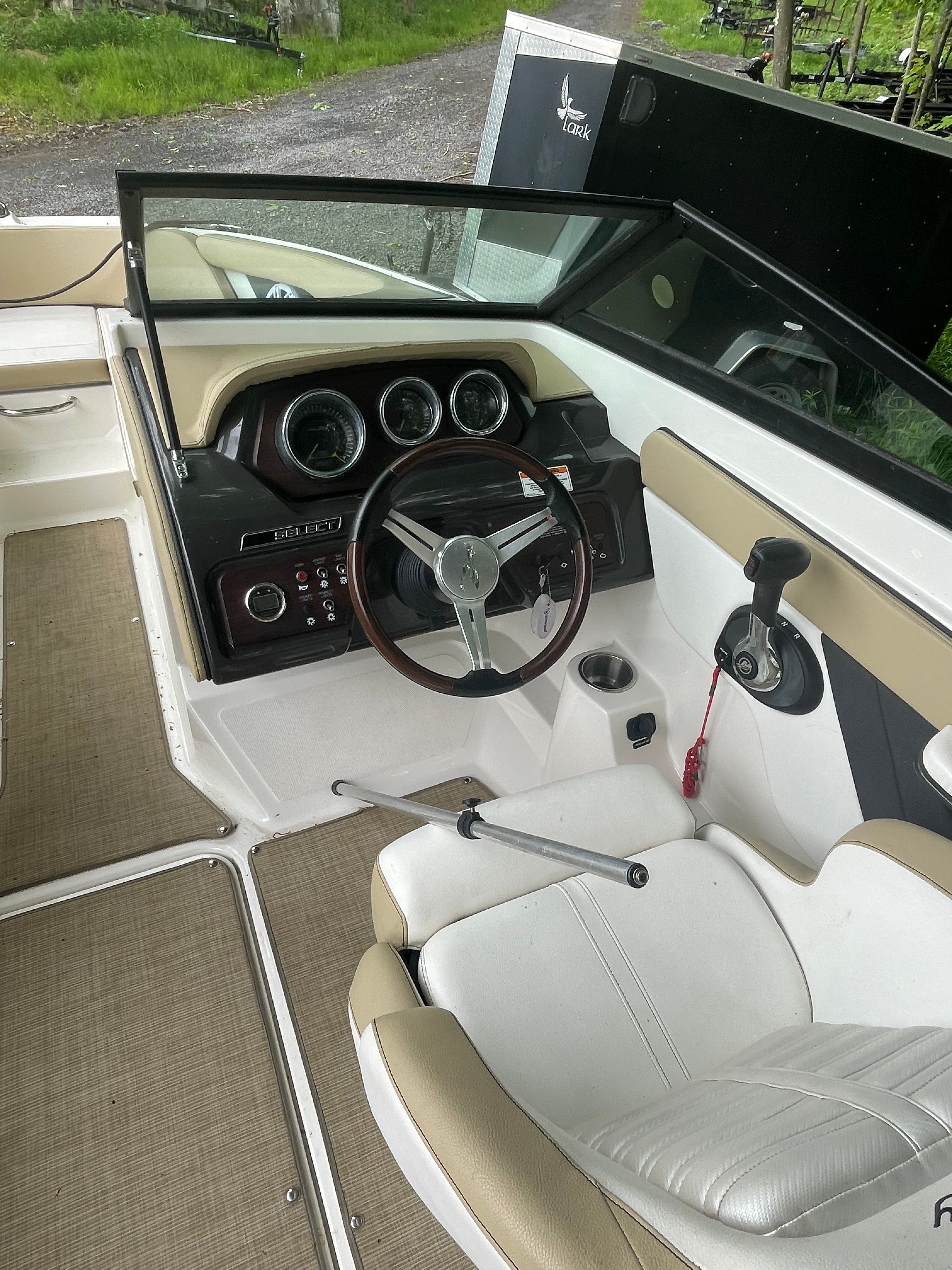 Interior of a 2016 Sea Ray 21 SPX boat with steering console.