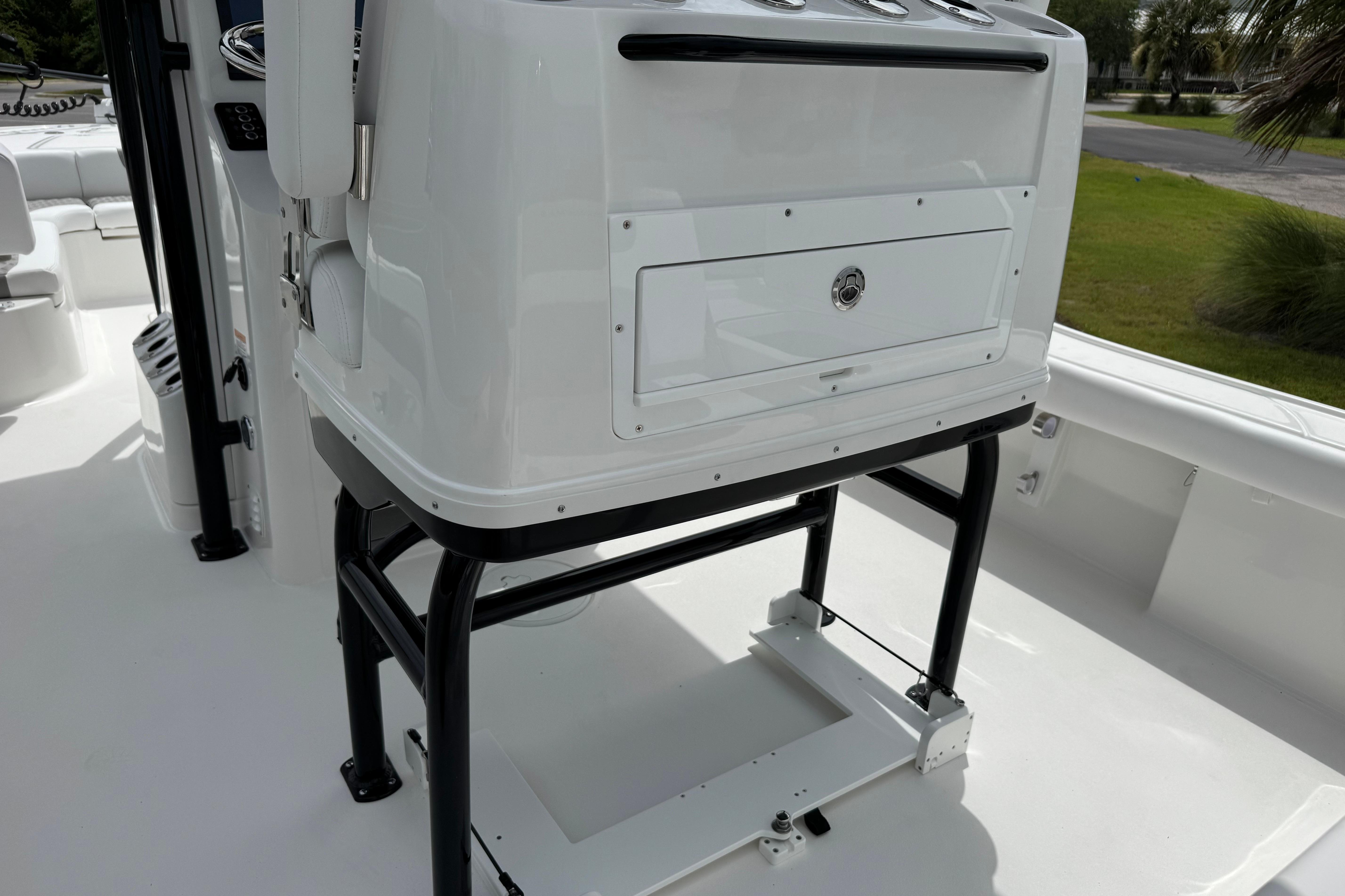 2027 Caymas 26 HB boat console with storage compartment and sleek design.