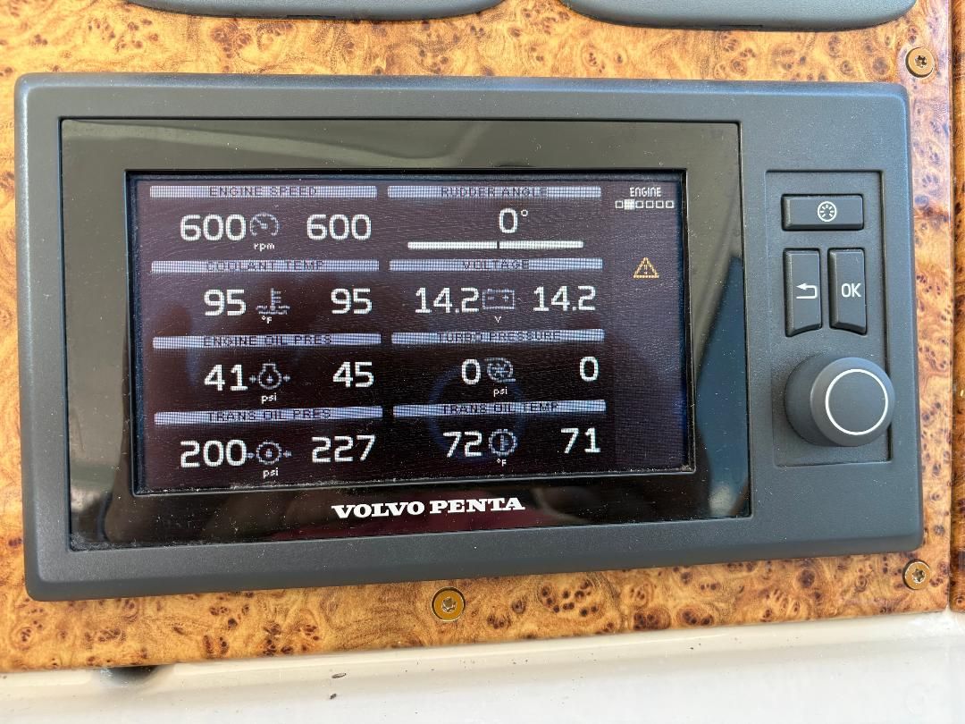 Volvo Penta monitor displaying engine data like RPM, coolant temperature, and oil pressure.