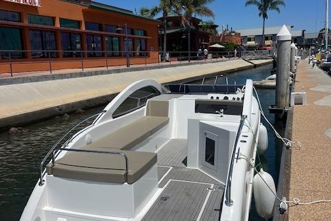 2024 Bracewell 25 boat docked at a marina with modern design and spacious seating.