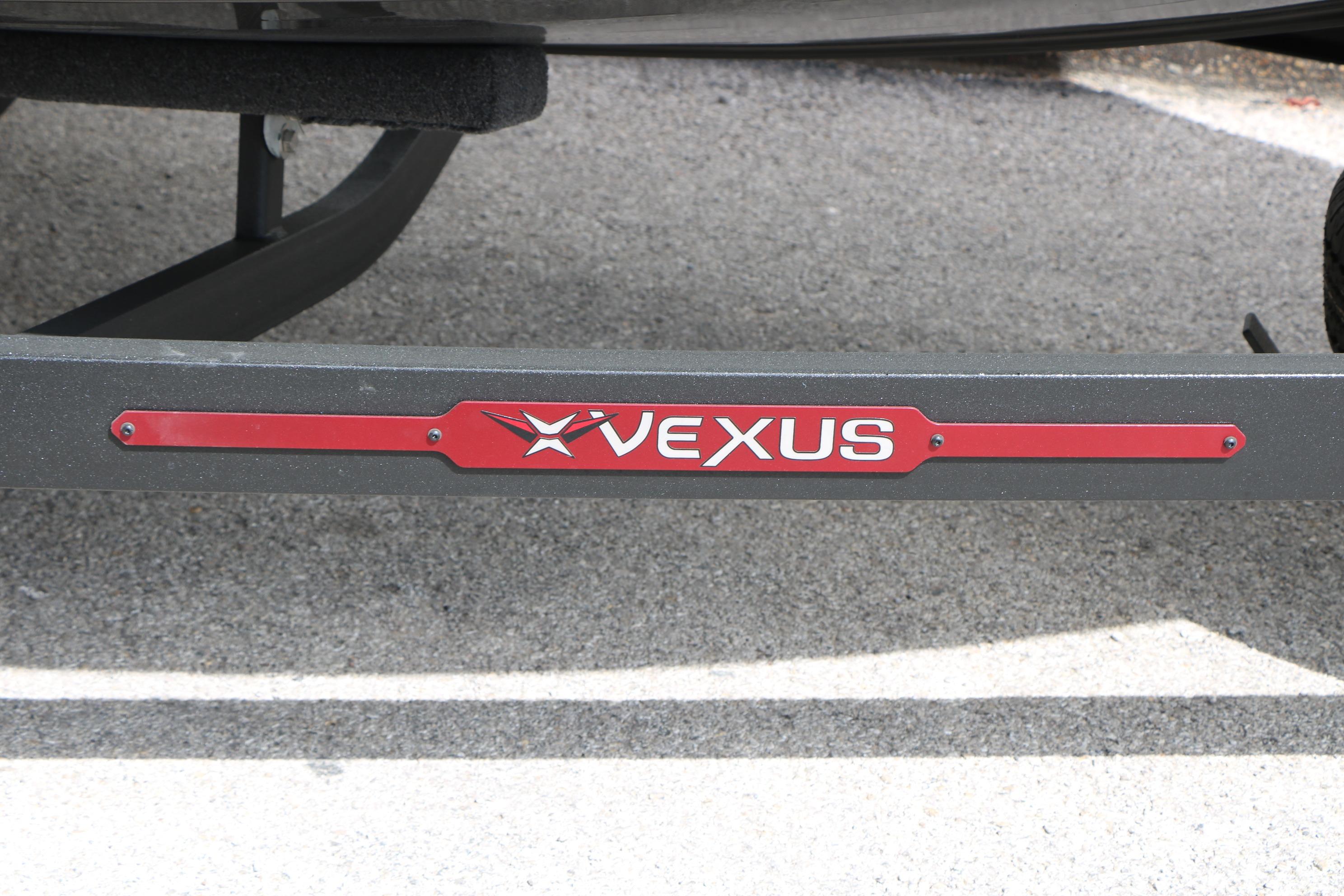 2026 Vexus AVX 1985s trailer with red logo on pavement background.