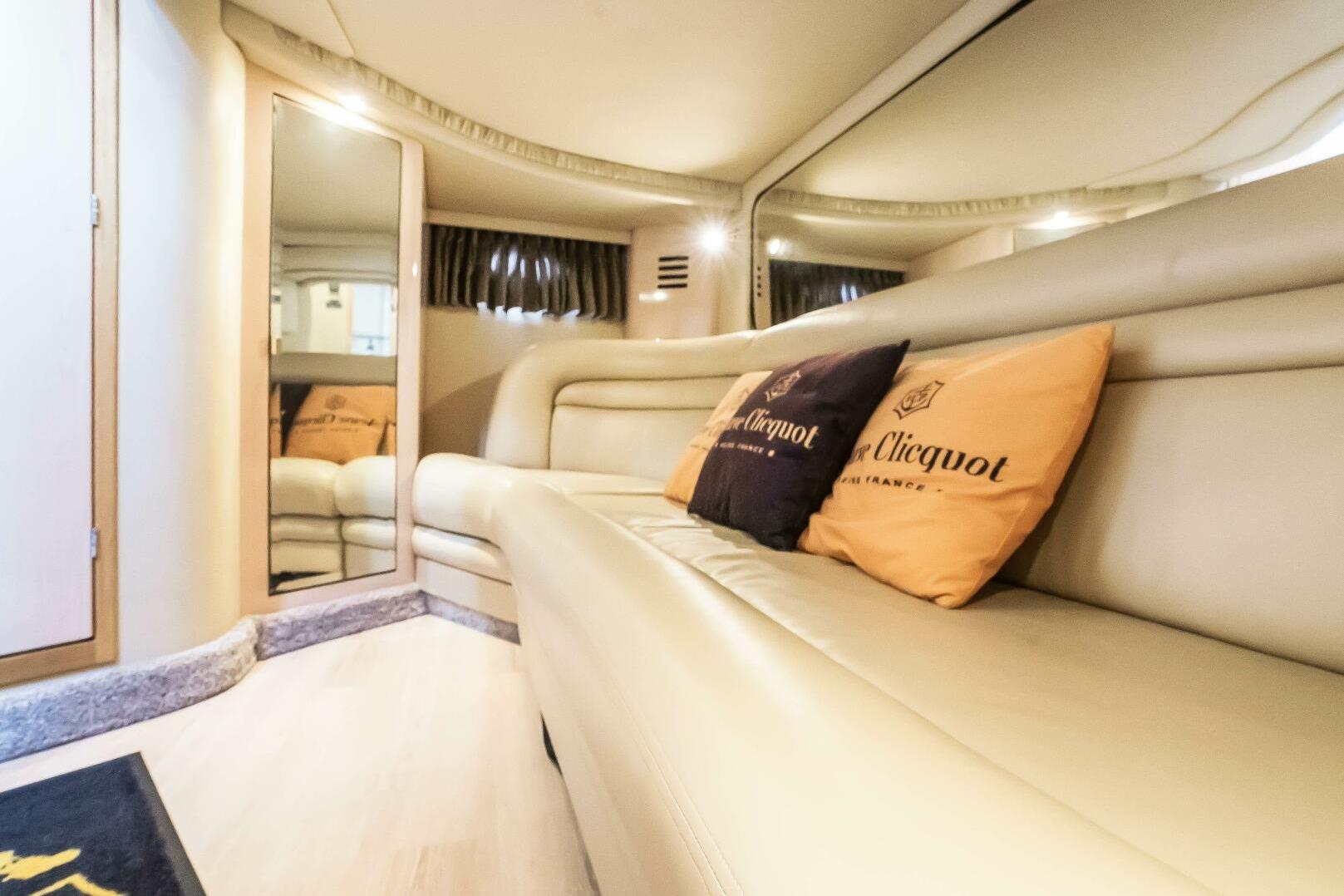 Luxurious interior of 2003 Sea Ray Sundancer 460 yacht with plush seating and elegant decor.