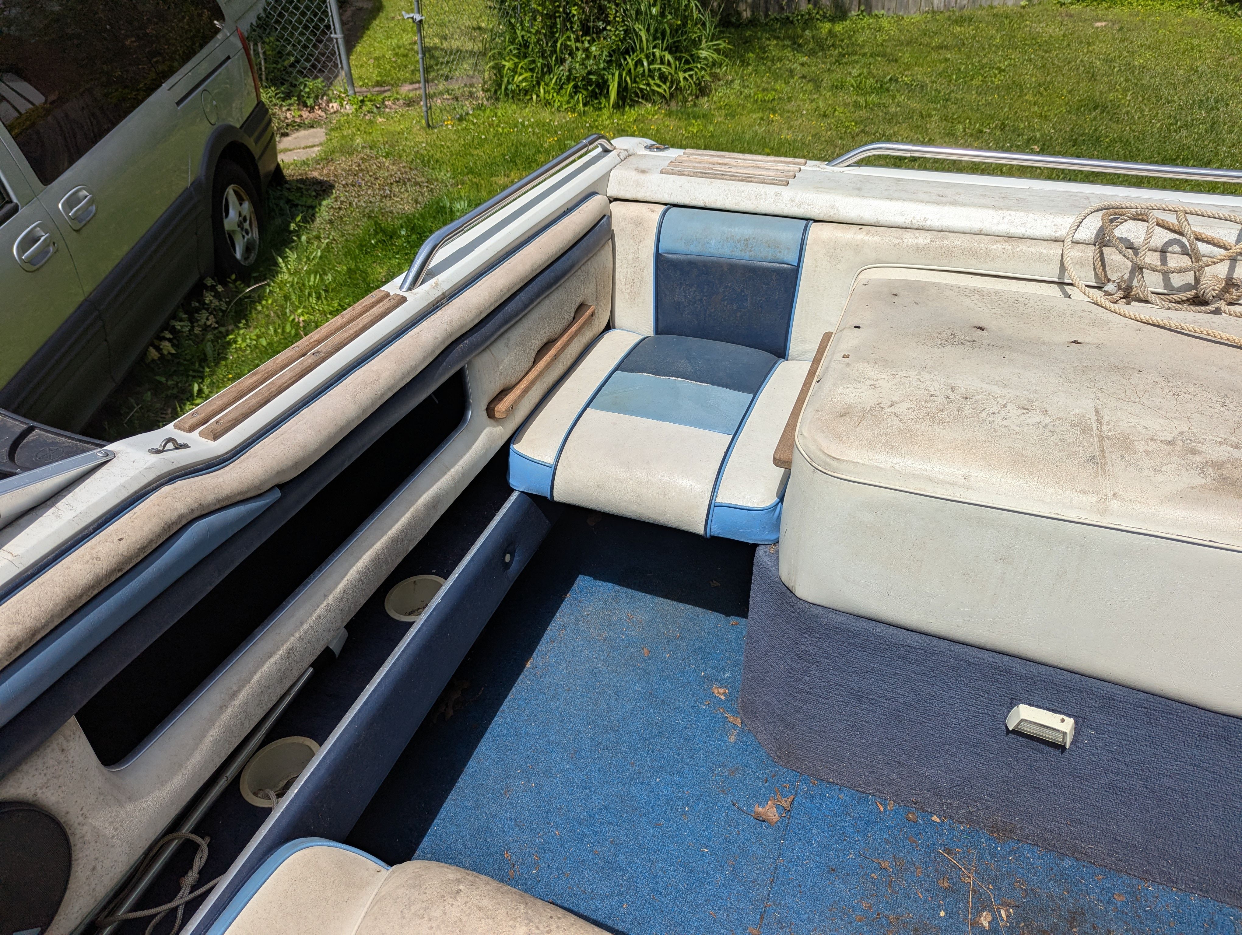 Interior of a 1988 Four Winns 200 Horizon boat with blue seats.