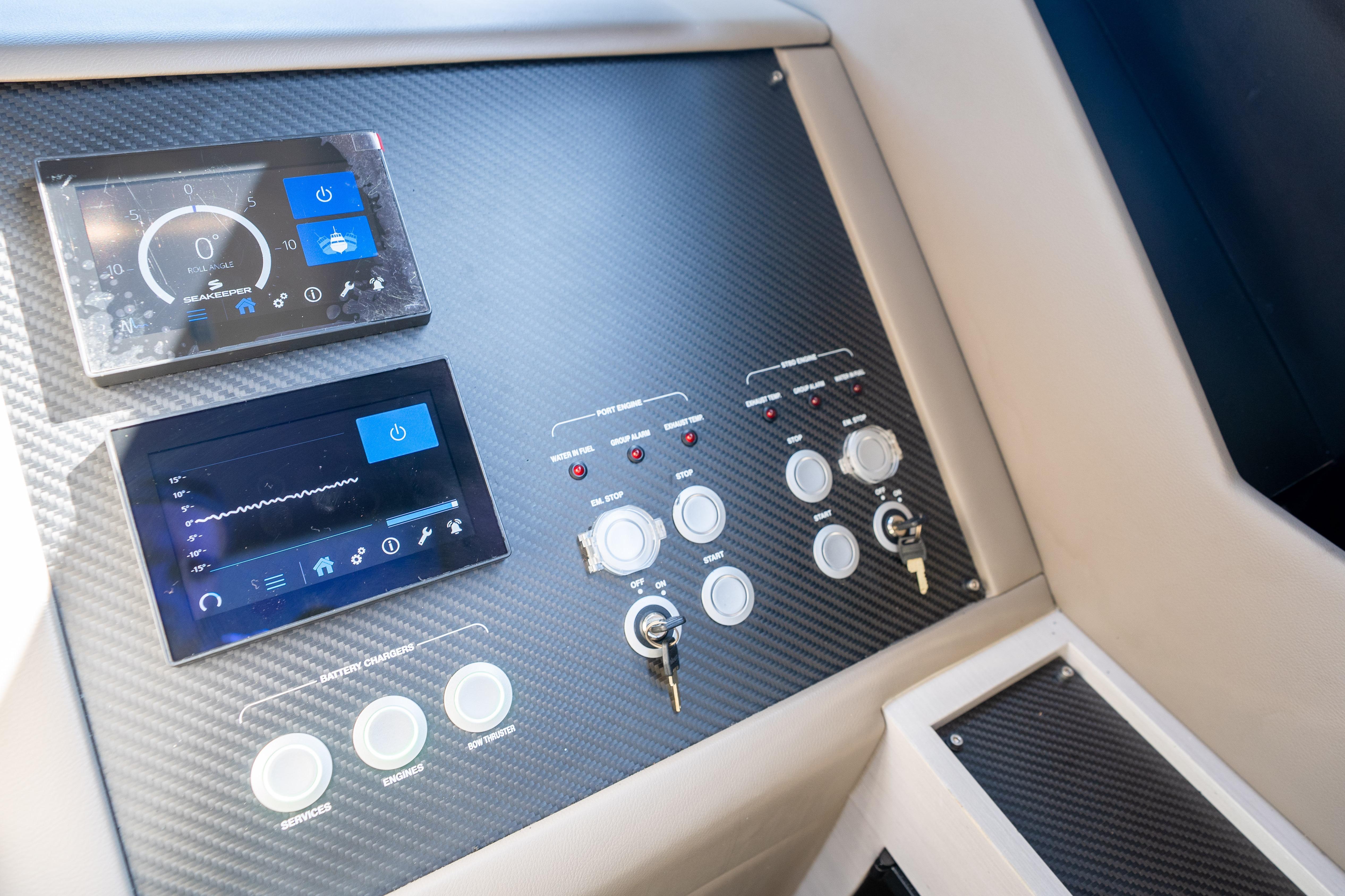 Control panel of 2024 Pershing 7X yacht with digital displays and switches.