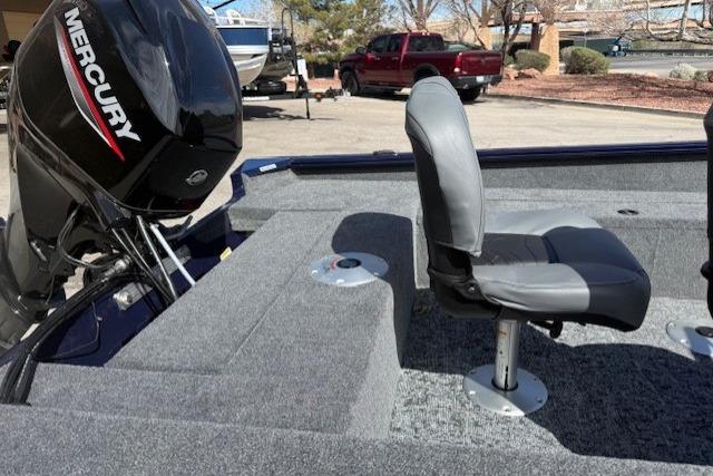 2026 Tracker Super Guide V-16 SC boat interior with Mercury engine and seating.
