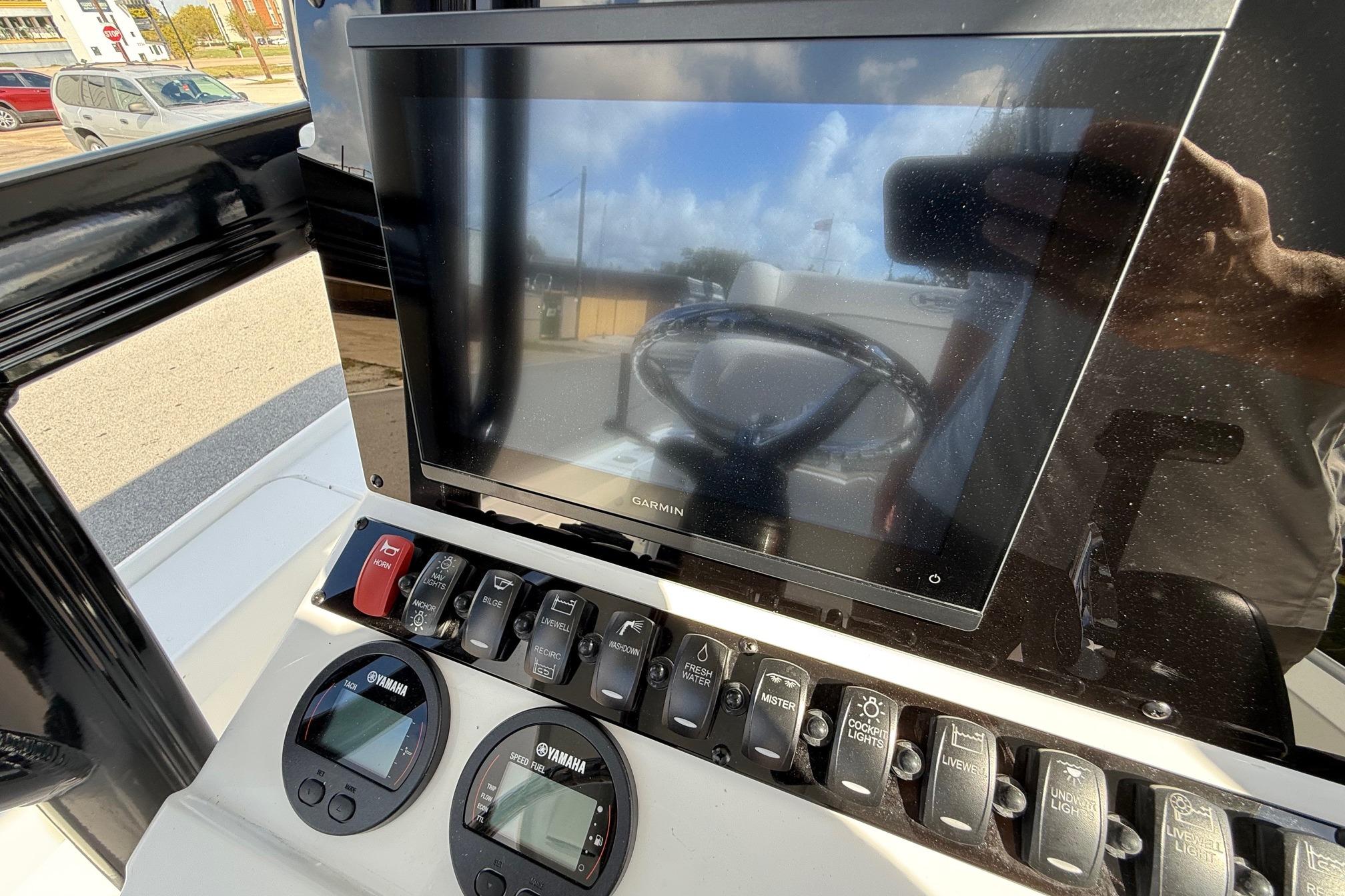 Control panel of 2026 Sea Hunt BX 22 BR boat with Garmin display and Yamaha gauges.