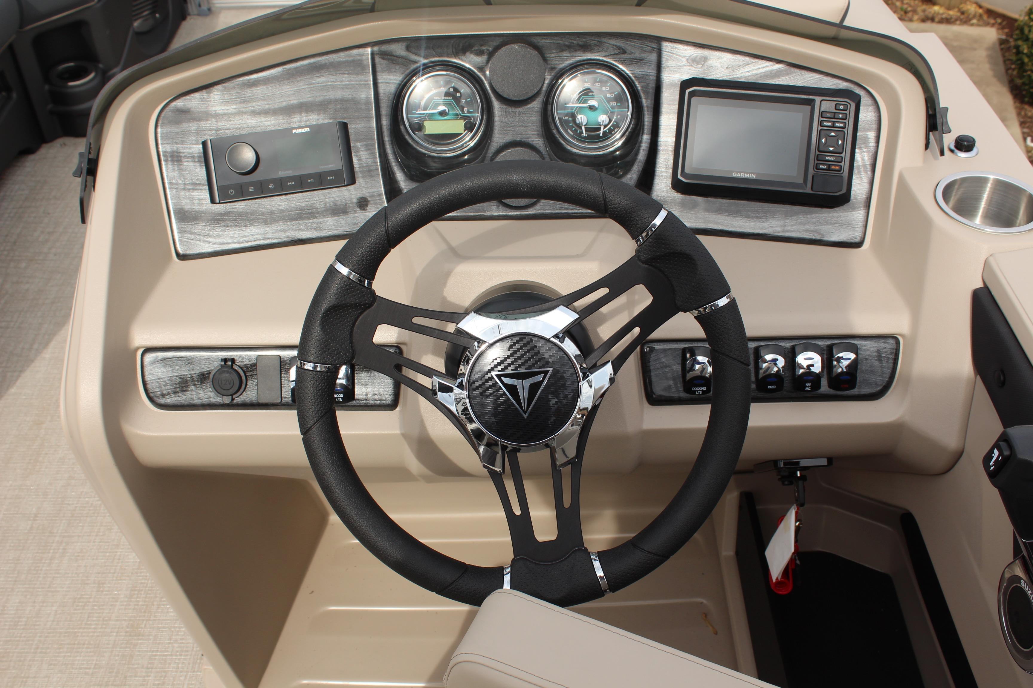 2026 Tahoe Pontoon LTZ dashboard with steering wheel and control panel.