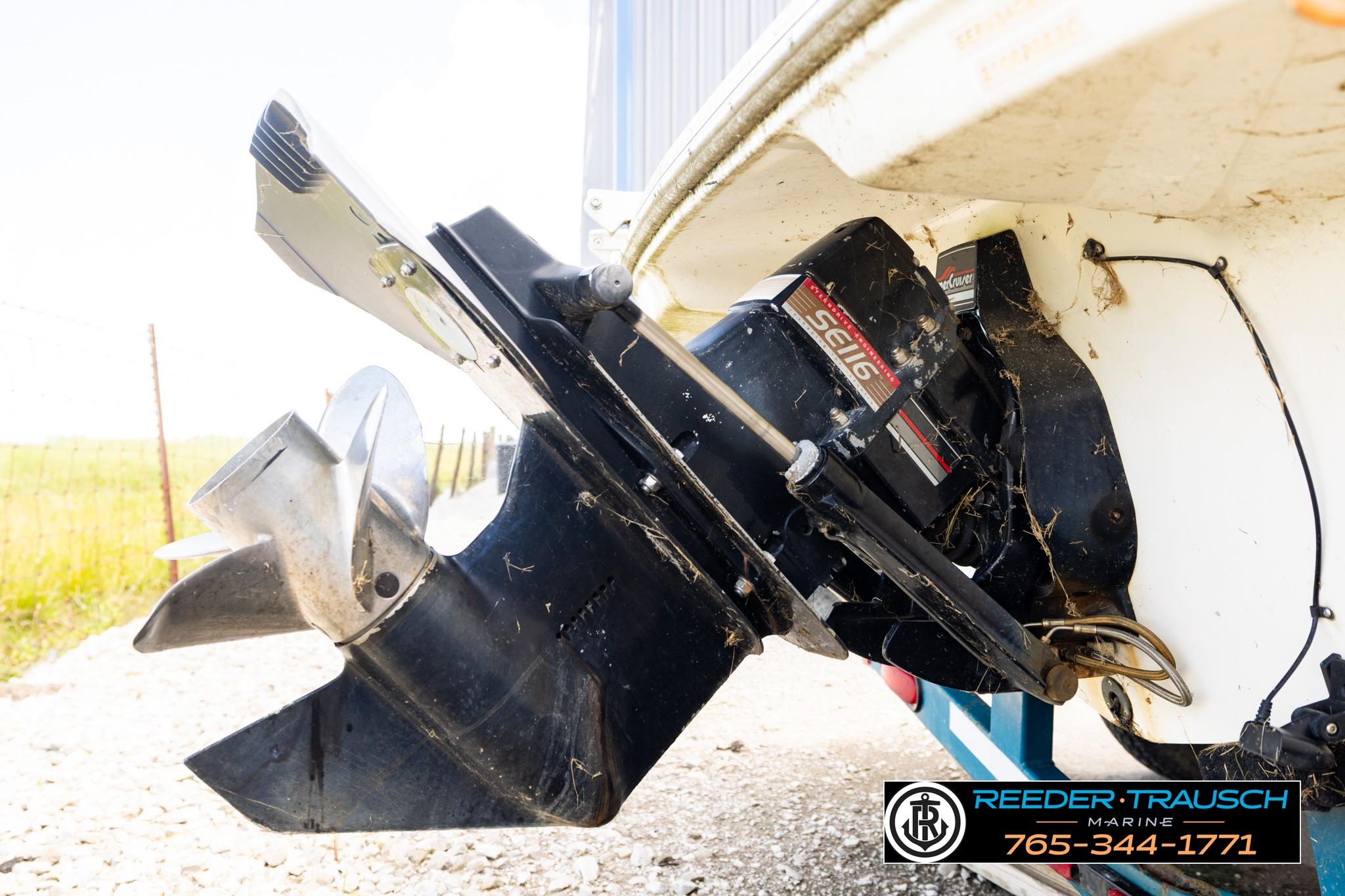 Close-up of a 1996 Sea Ray 210 Bow Rider boat's outboard motor and propeller.