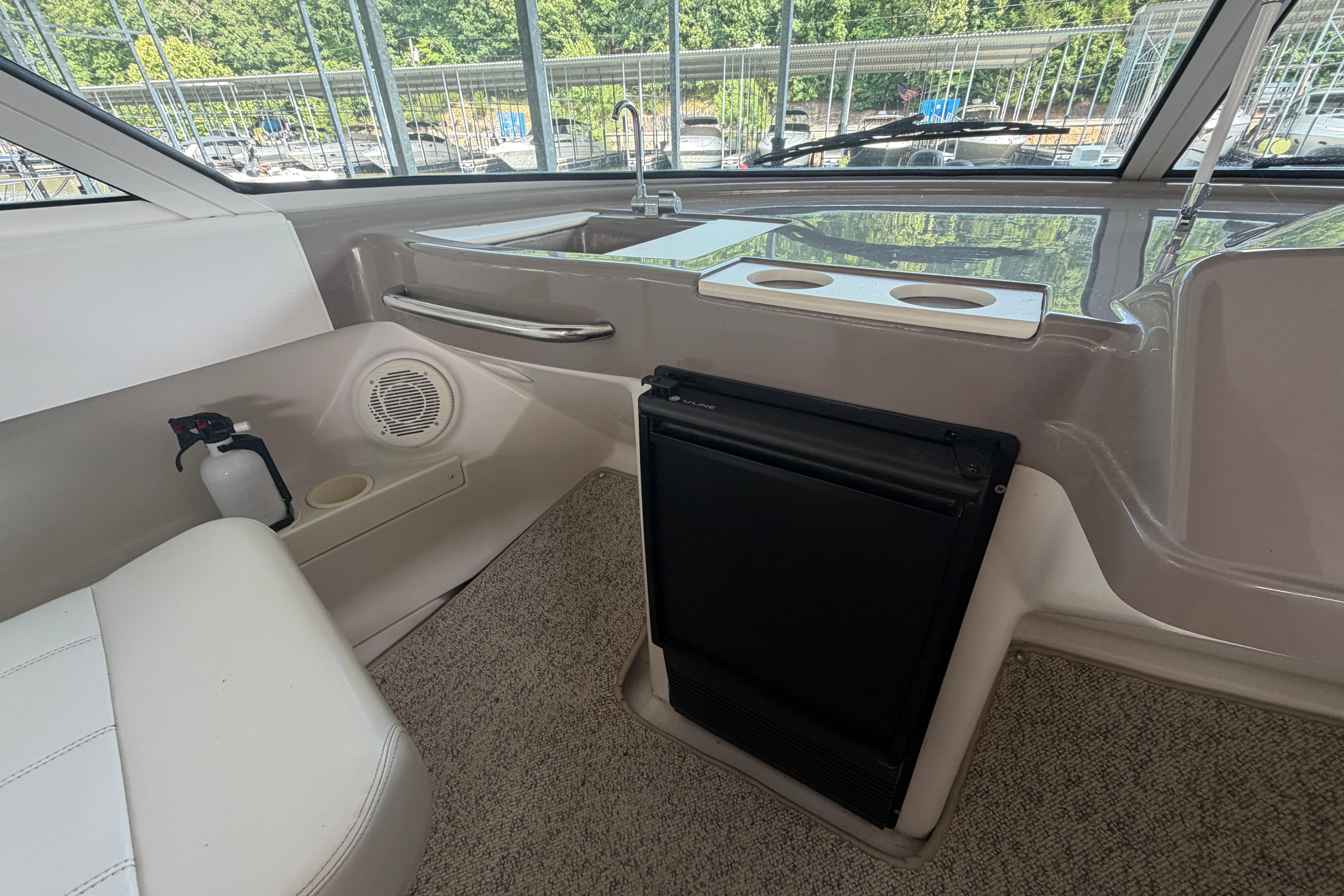 Interior of 2000 Carver 350 Mariner yacht with seating, sink, and storage.