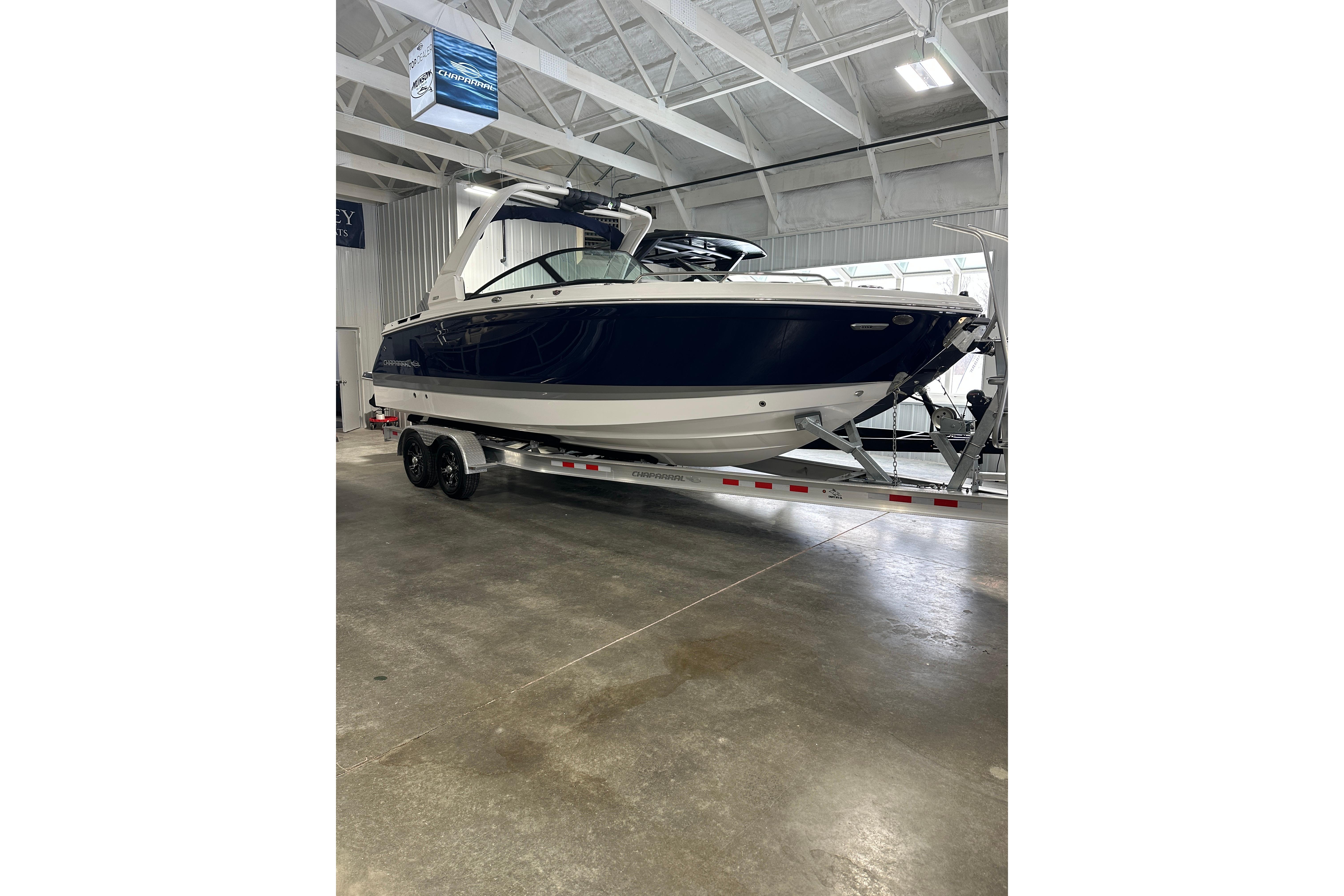 2026 Chaparral SSX 8 boat on trailer in indoor facility.