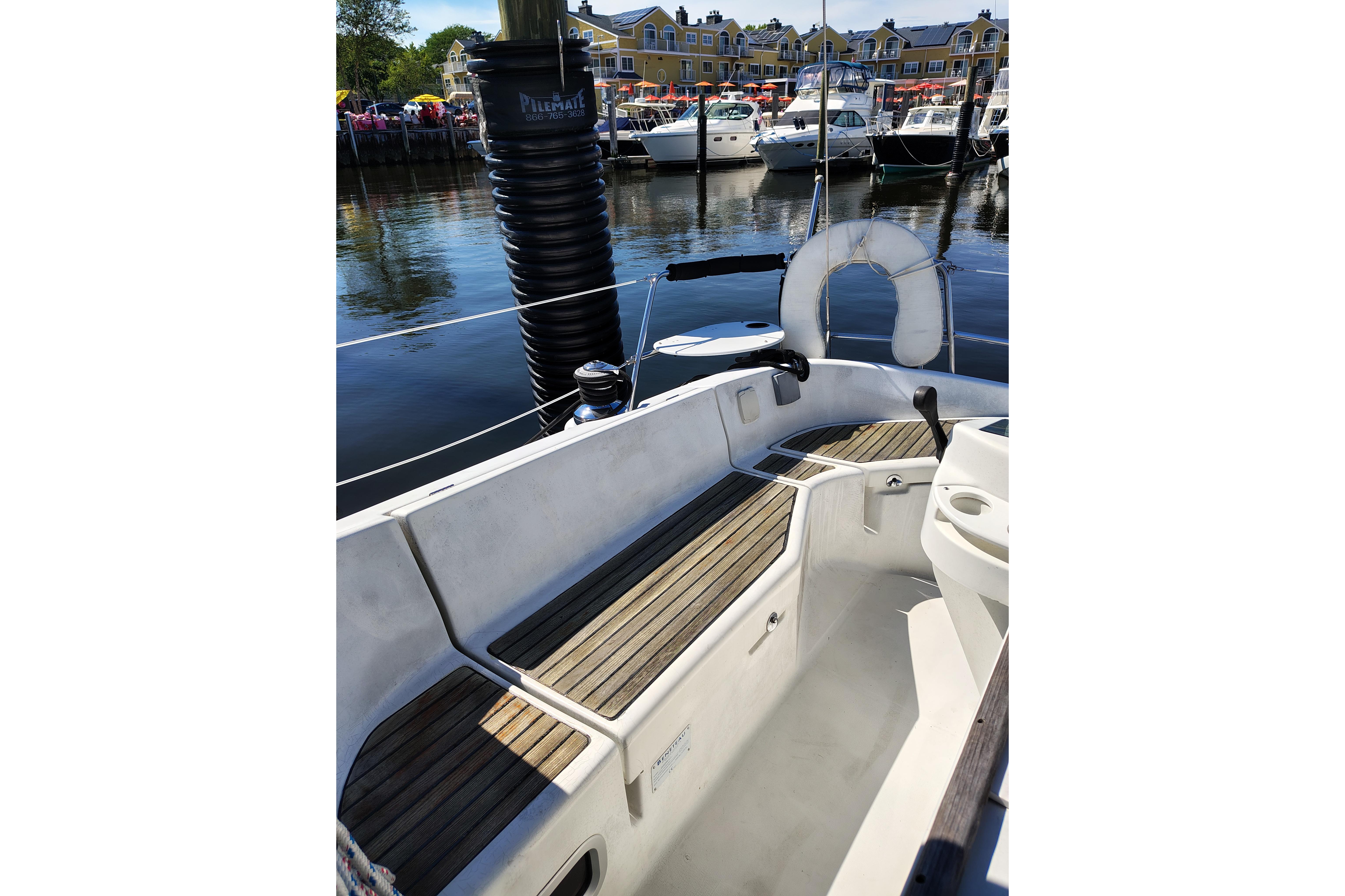 Cockpit of 2001 Beneteau Oceanis 411 sailboat docked in a marina.