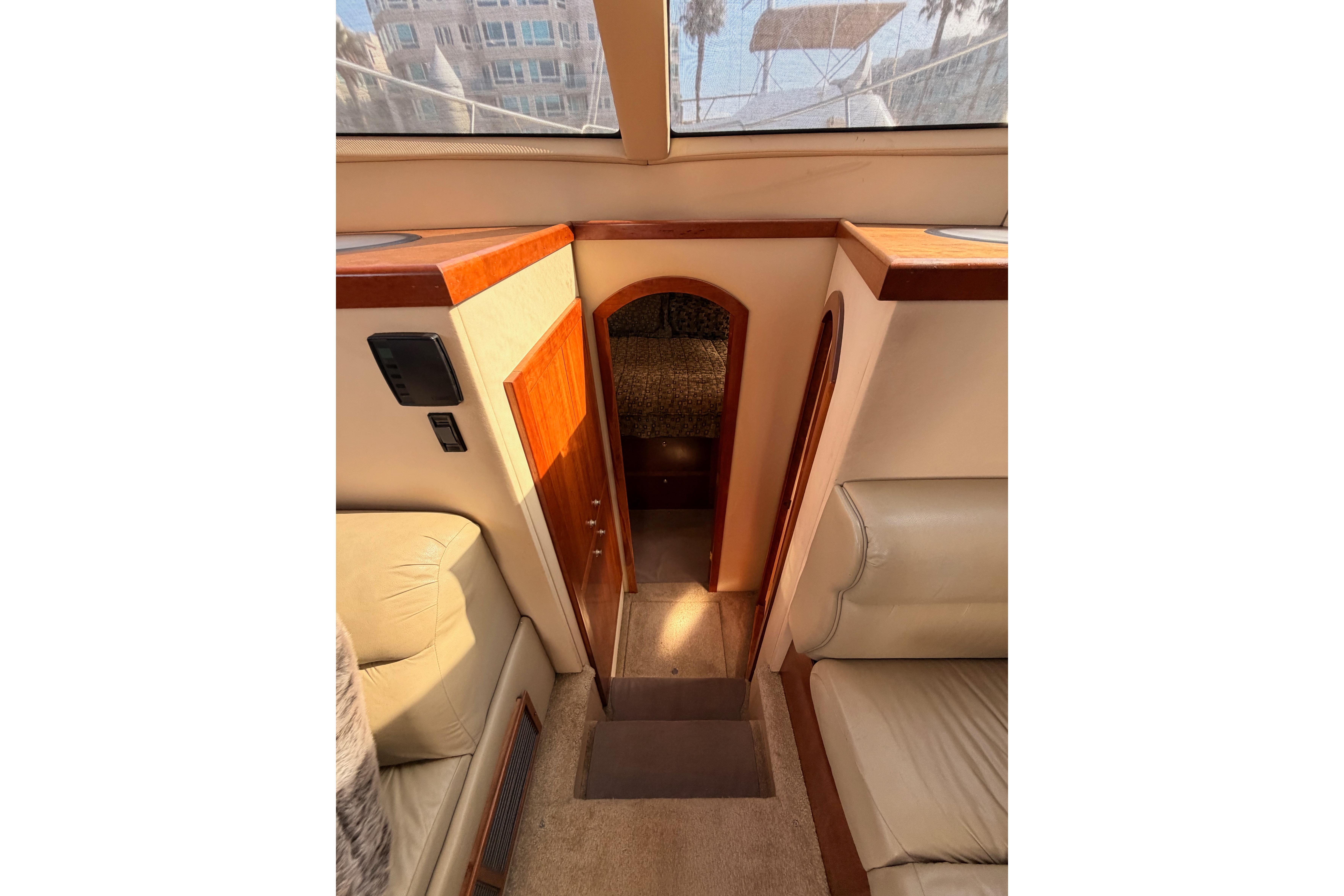 Interior view of 2005 Cruisers Yachts 405 Express Motoryacht, featuring elegant wood finishes.