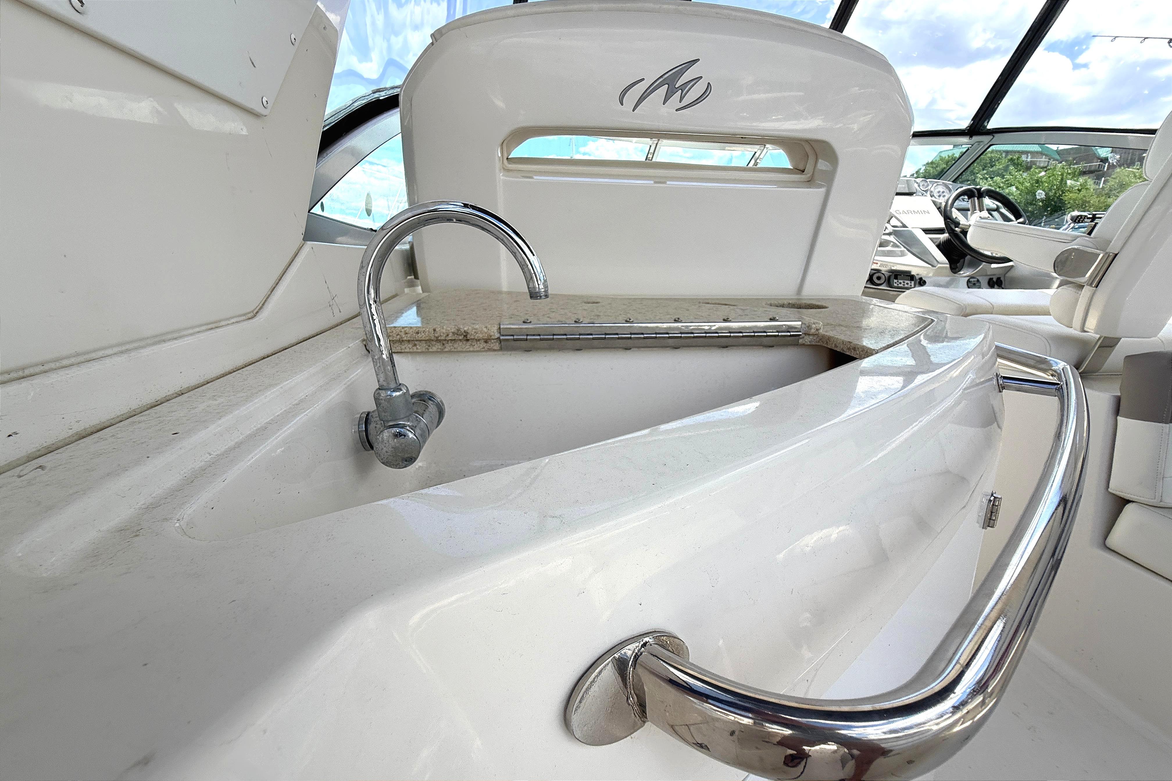 2011 Monterey 320 Sport Yacht interior with sink and chrome fixtures.