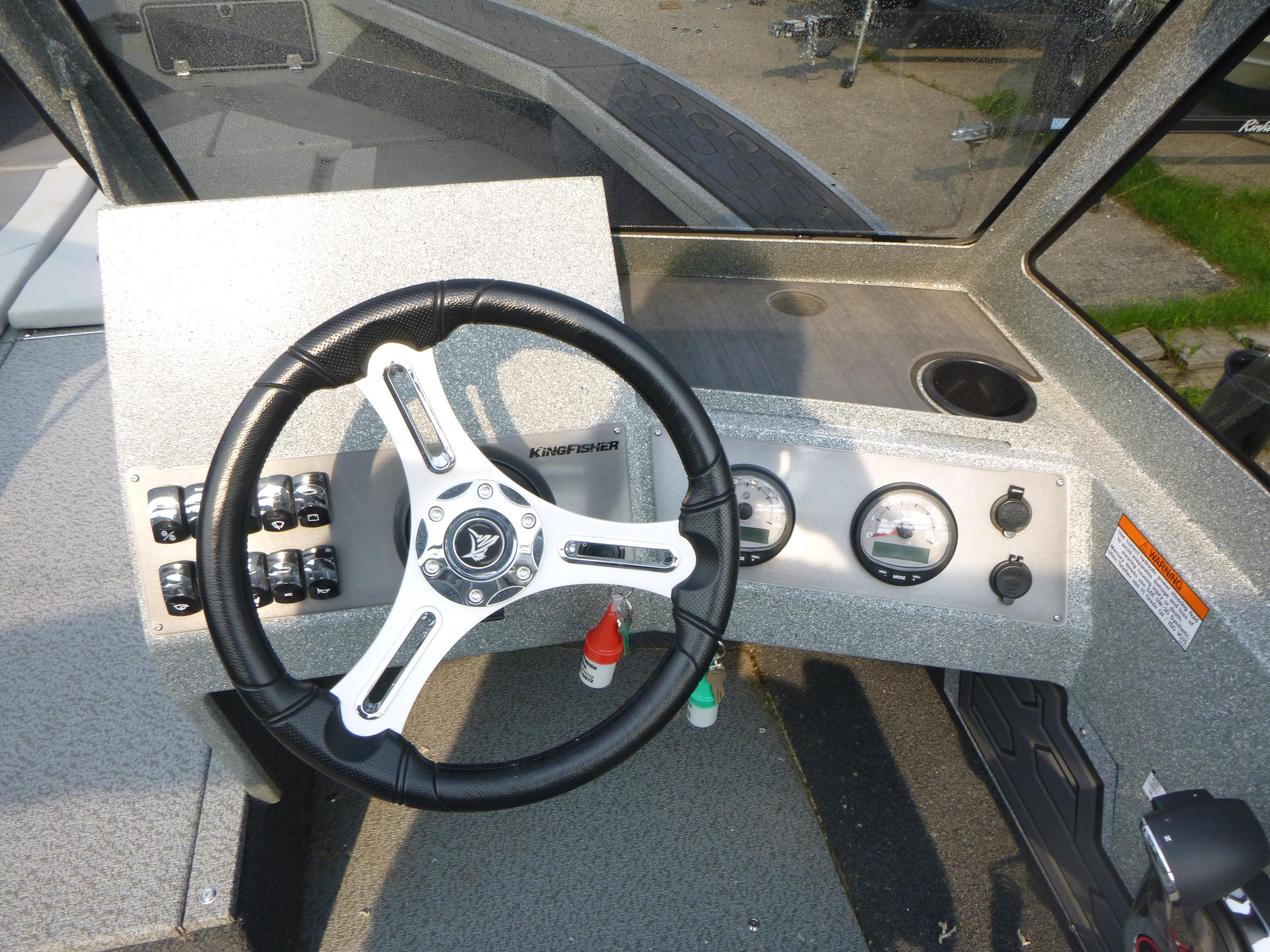 Steering wheel and dashboard of 2025 KingFisher 2125 Arrow Sport boat.