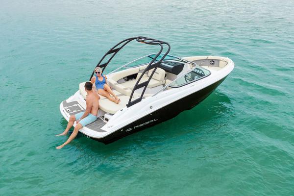 Manufacturer Provided Image: 2026 Regal 2000 ES boat with two people relaxing on turquoise water.