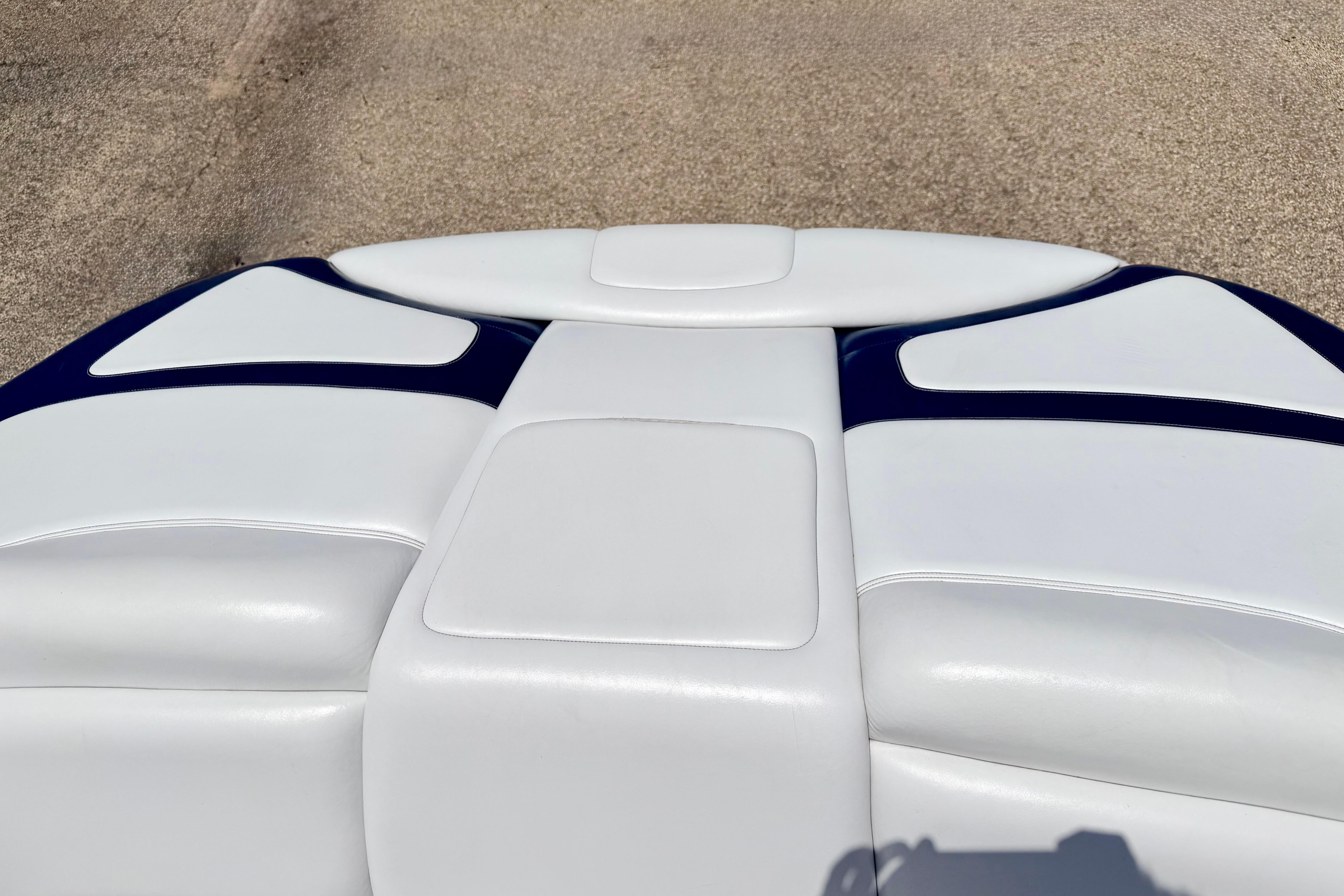 2004 Bombardier SEADOO Utopia 185 boat seat with white and blue upholstery.