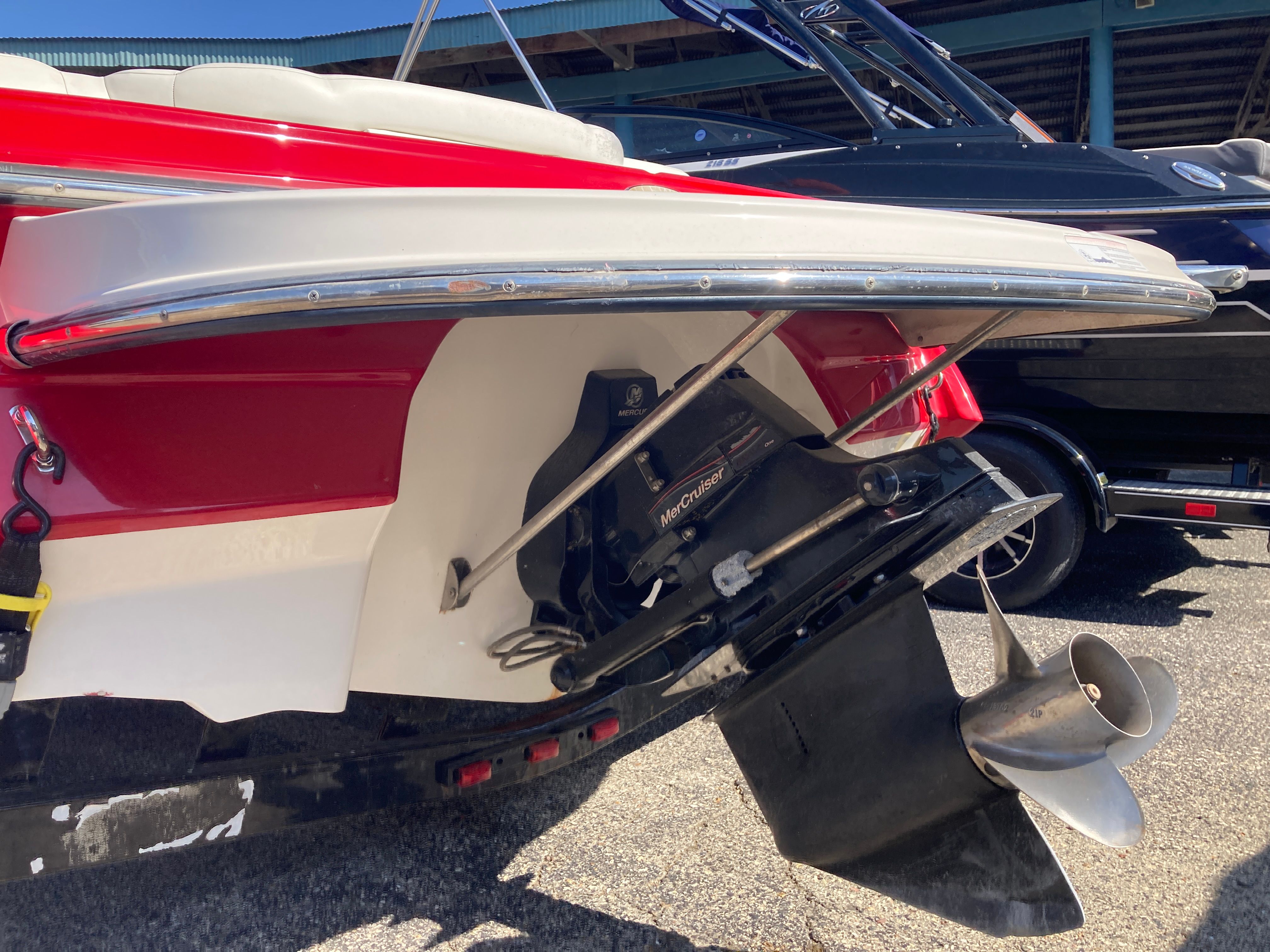 Red 2012 Monterey 204FS boat with MerCruiser drive.