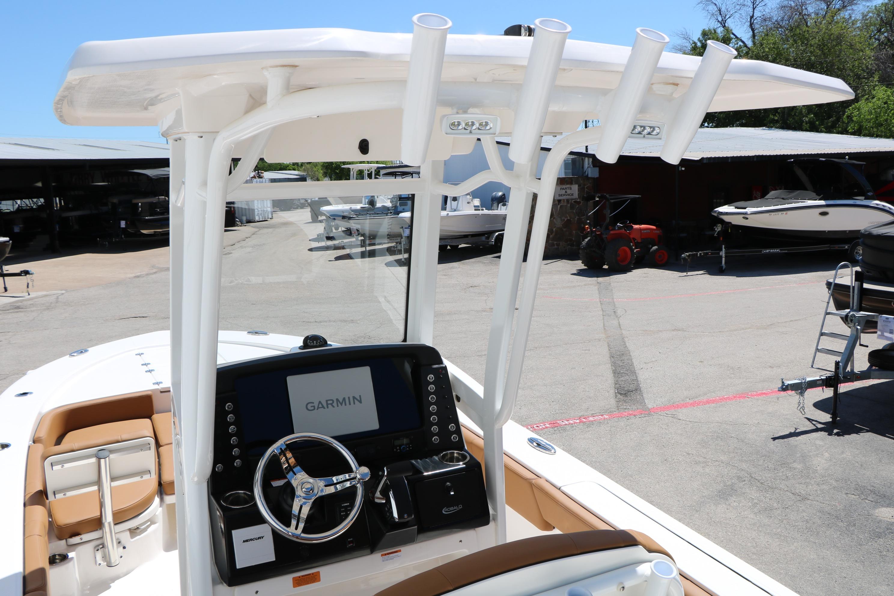 2026 Robalo 246 Cayman boat console with Garmin display and steering wheel.