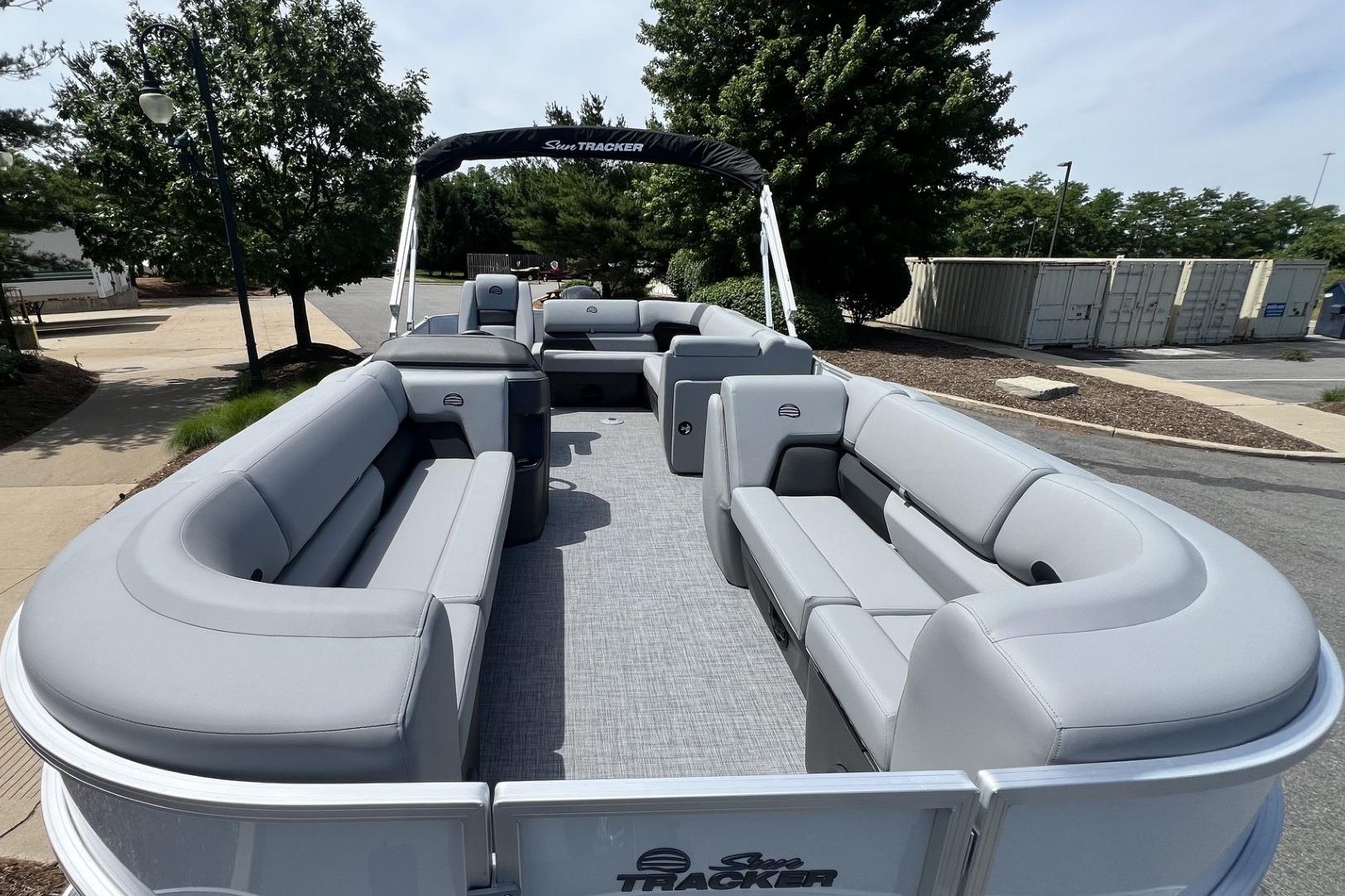 2026 Sun Tracker Party Barge 20 DLX pontoon boat with spacious seating and modern design.