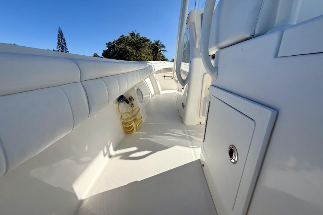 2019 Regulator 31 boat deck with white seating and storage compartments.