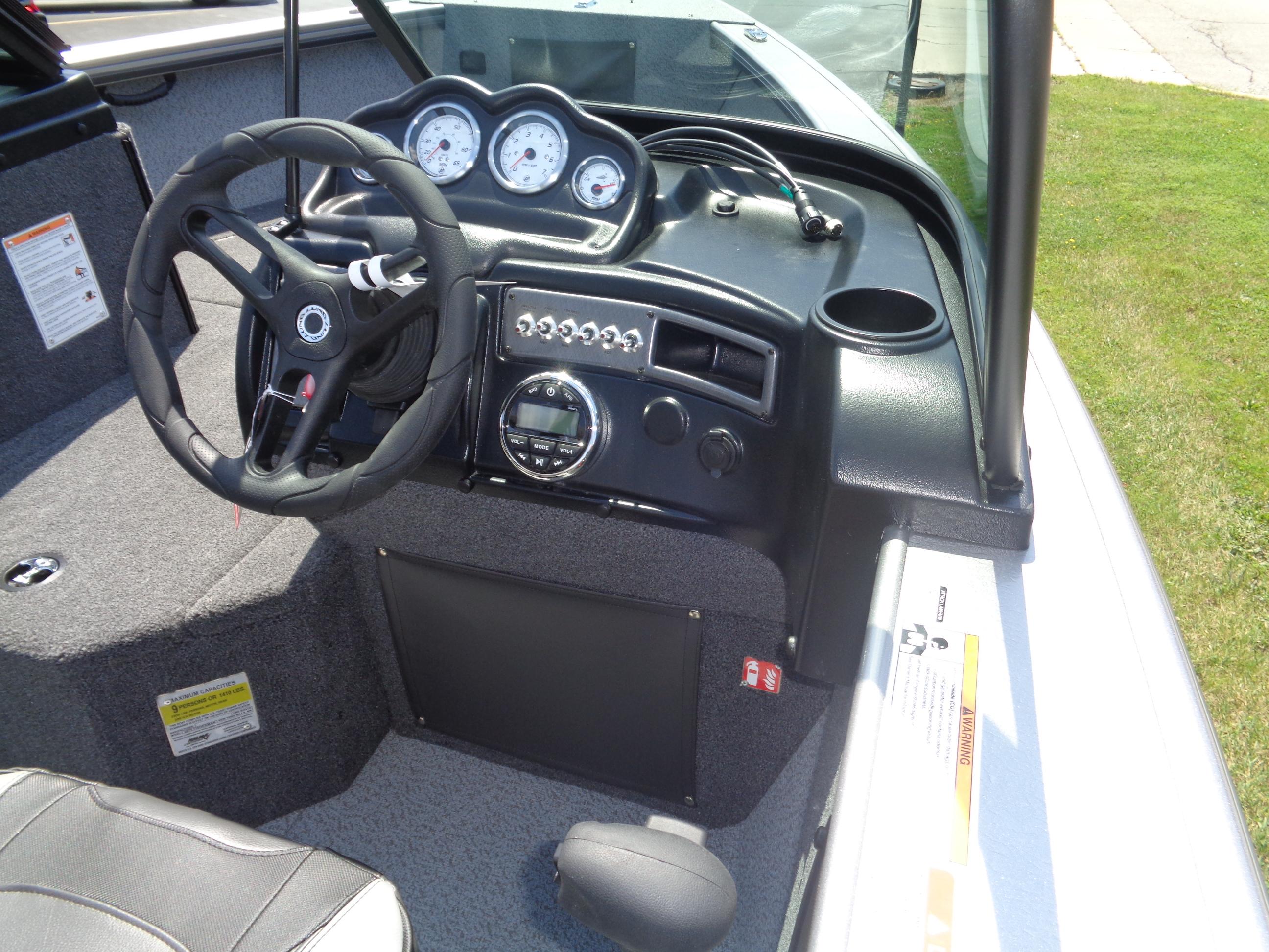 2025 Lund 2075 Fisherman boat dashboard with steering wheel and gauges.