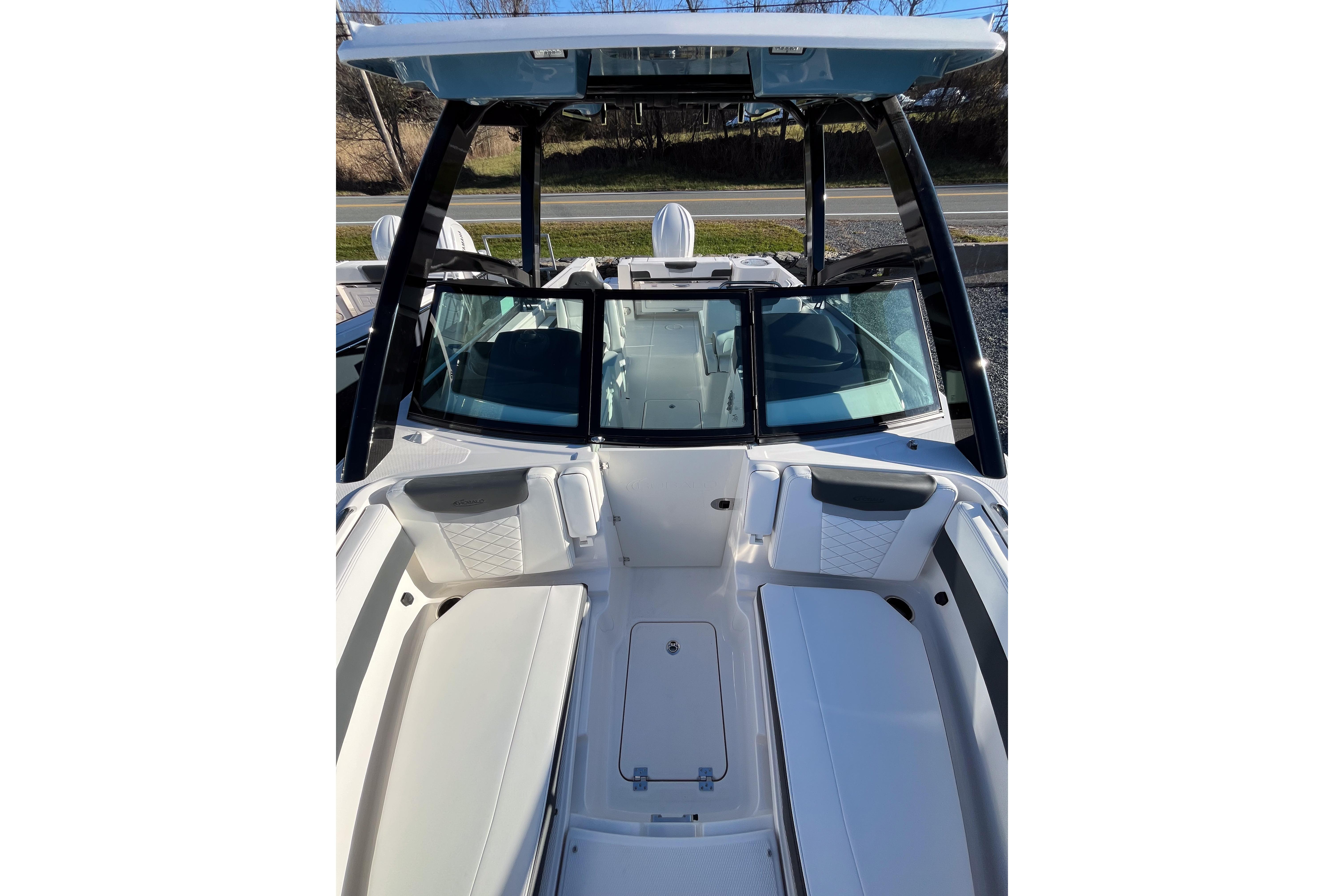 2026 Robalo R257 Dual Console boat interior with seating and windshield.