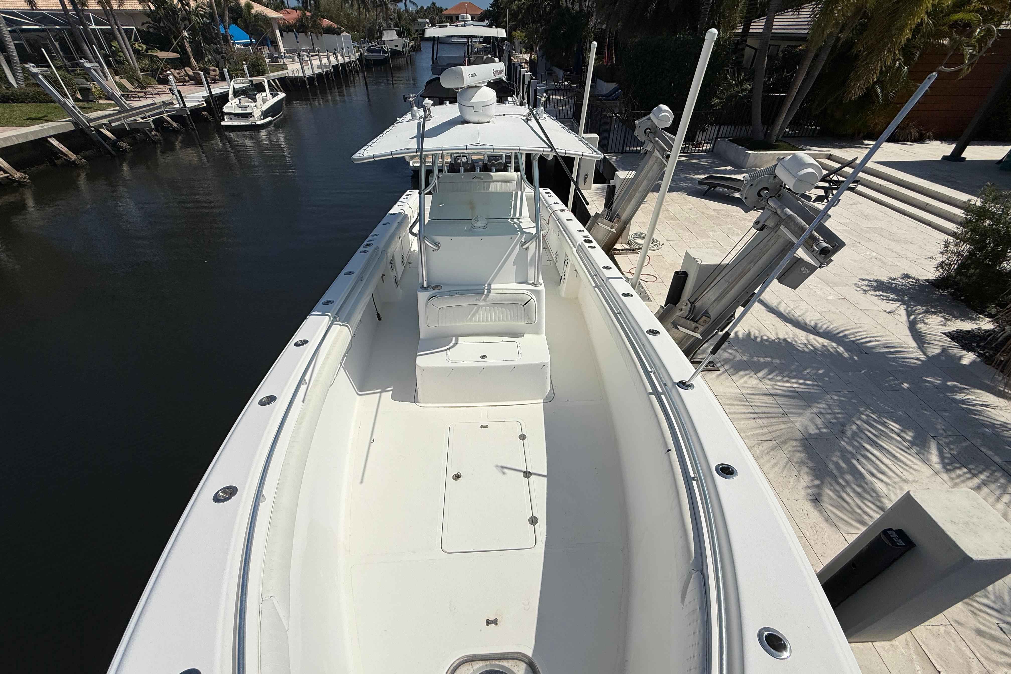 2003 Palmetto 33 Adventure boat docked in a serene canal setting.