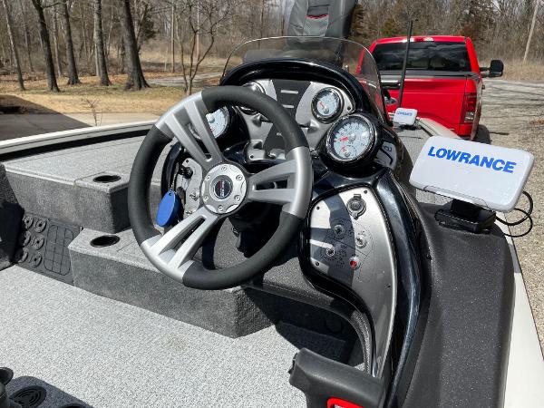 2021 Tracker Pro 195 XTE boat dashboard with steering wheel and Lowrance navigation system.