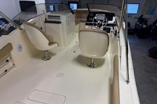 2021 Scout 215 Dorado boat interior with helm and seating area.