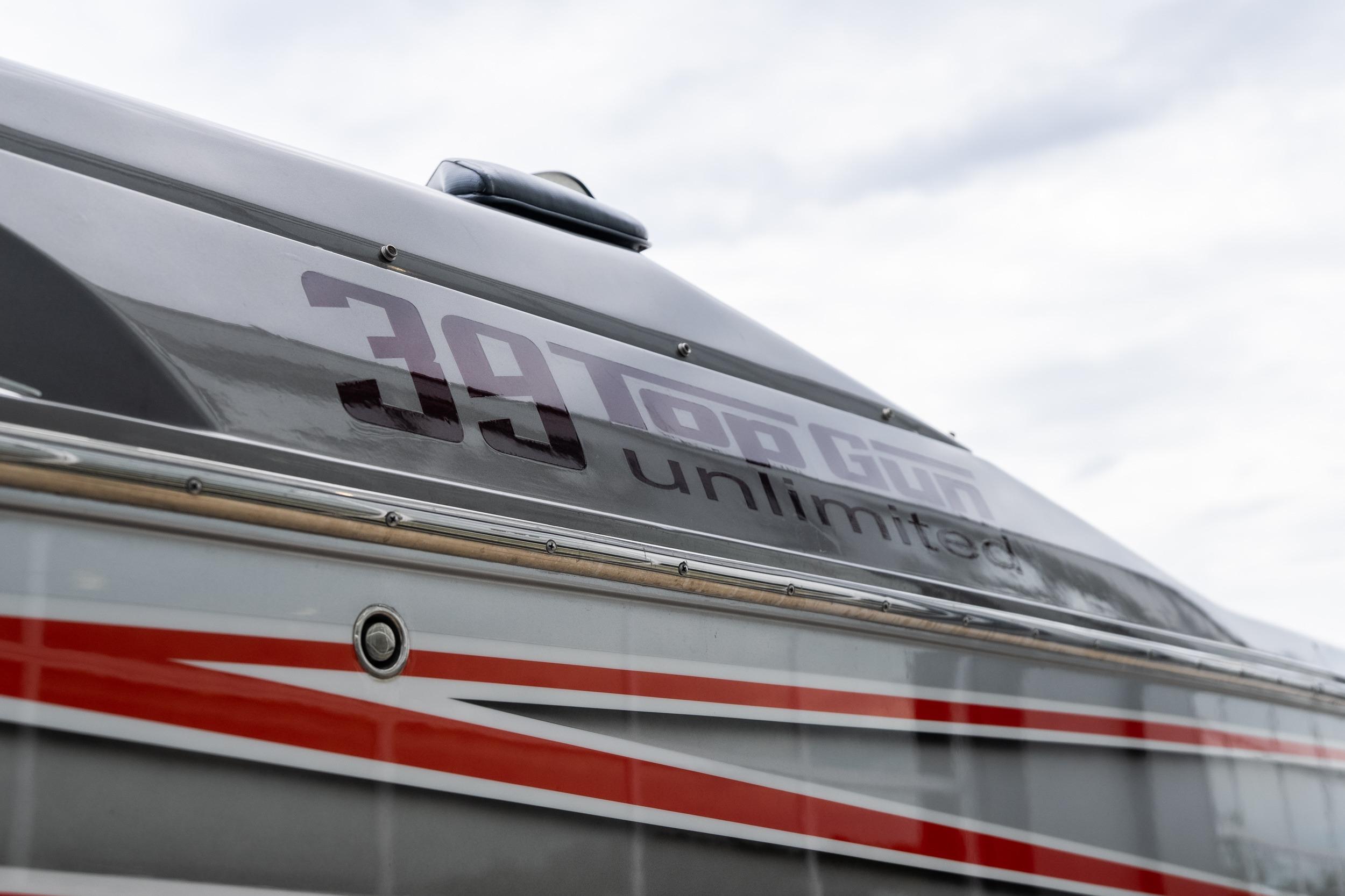2006 Cigarette 39' Top Gun Unlimited boat with sleek design and bold graphics.