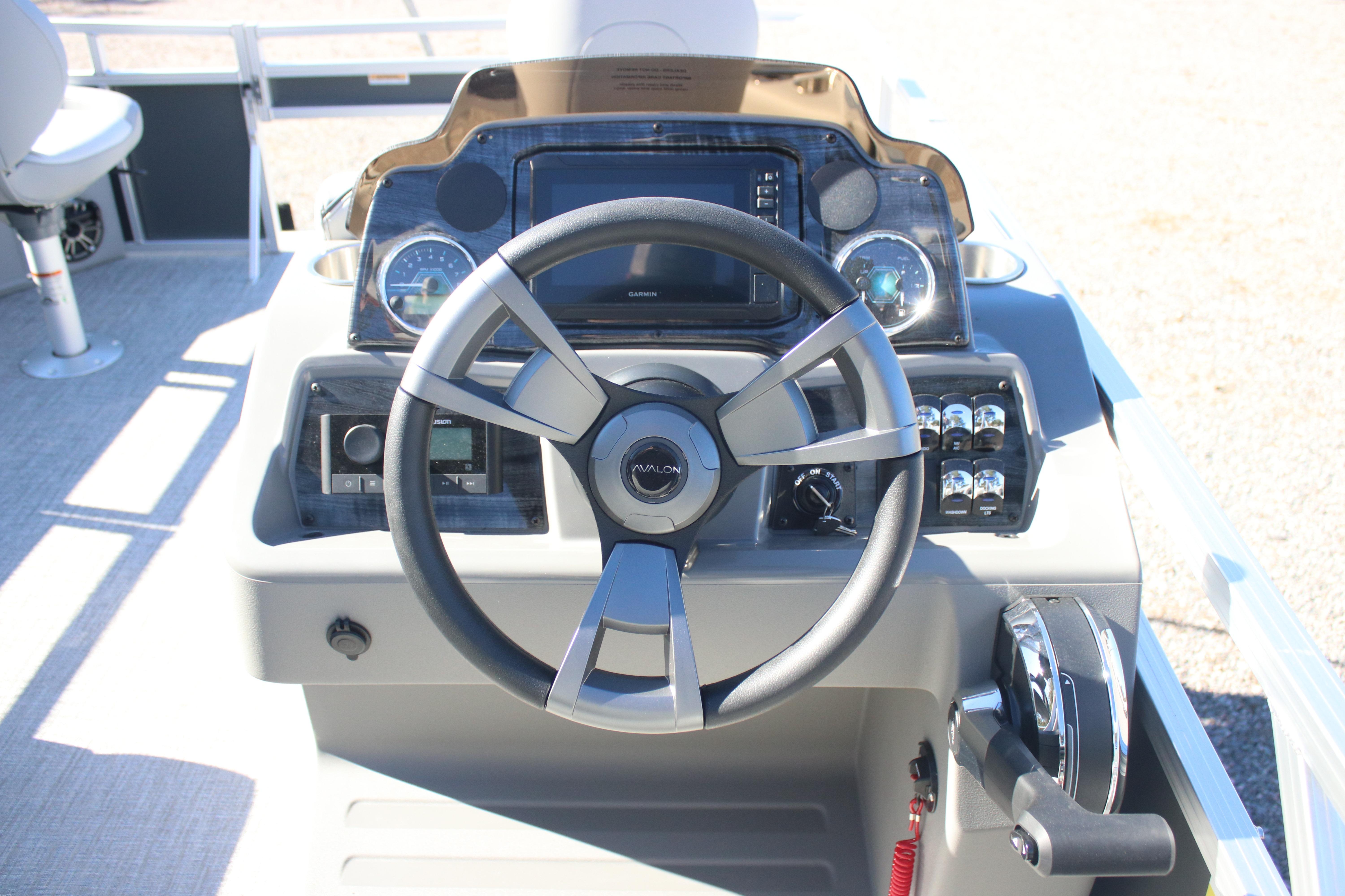 Steering console of 2026 Avalon VENTURE 85 QUAD boat with modern controls and dashboard.