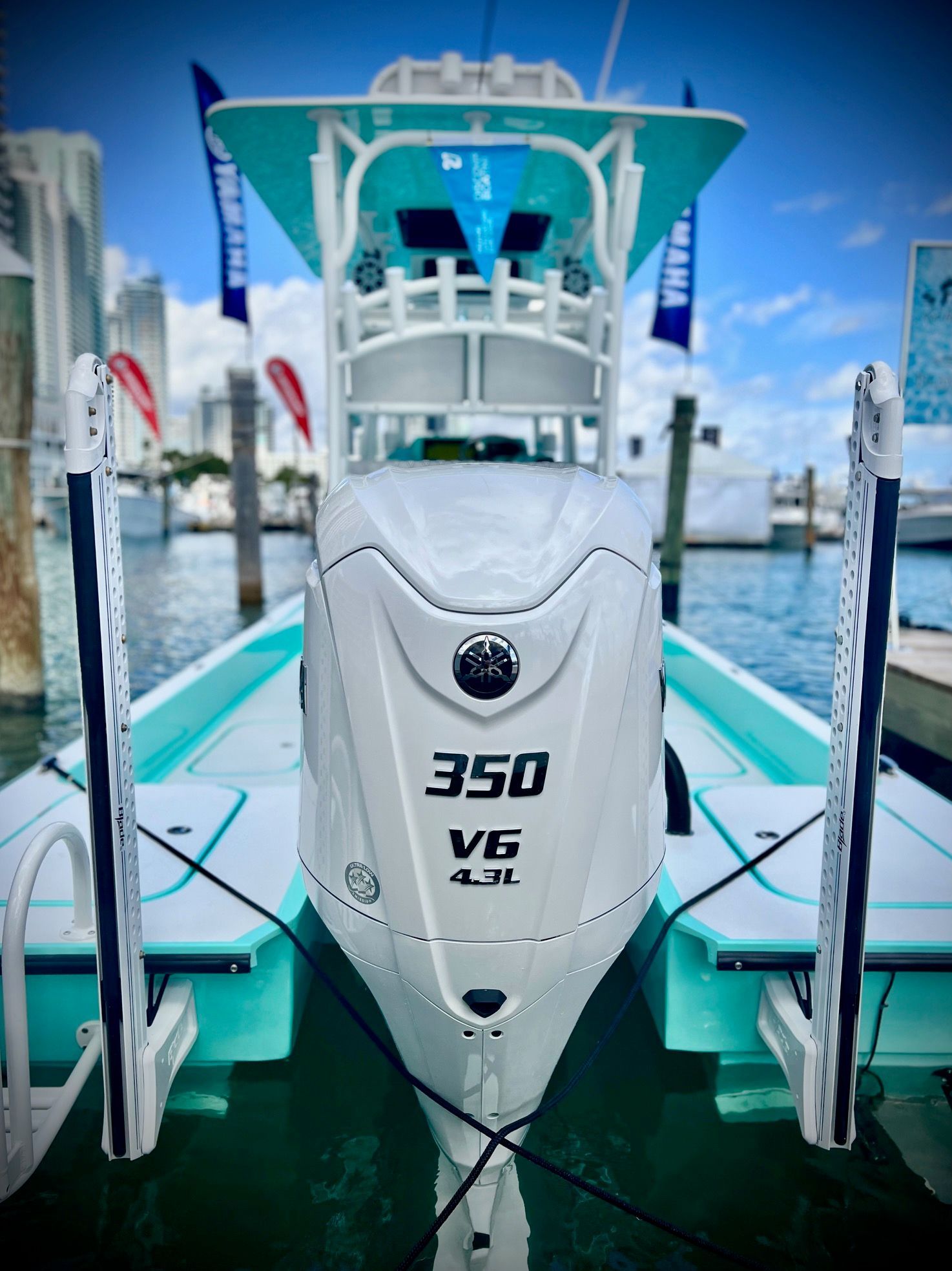 A Shallow Sport 25 X3 boat with a 350 HP V6 engine docked at the marina.