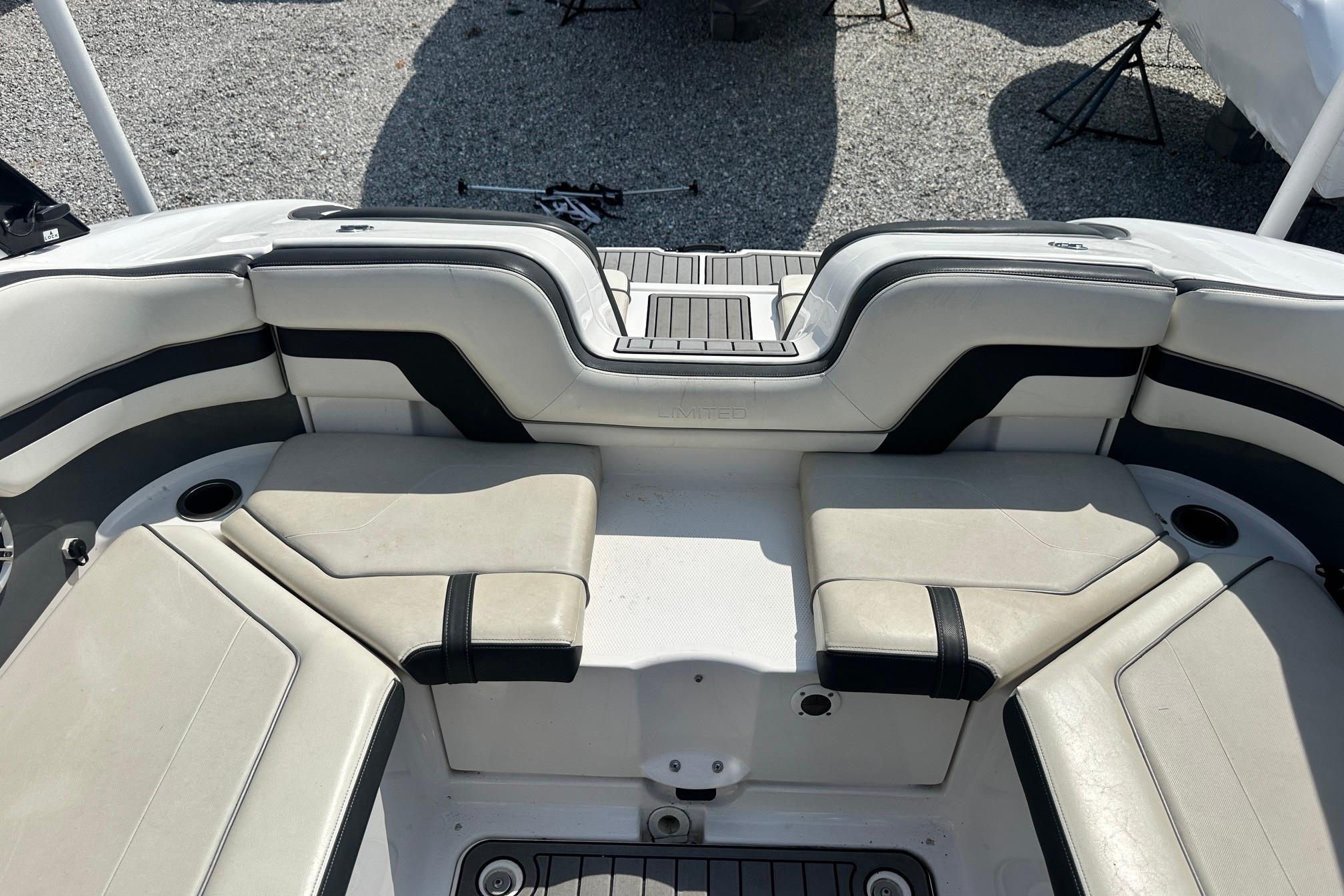 2016 Yamaha 242 Limited S boat interior with cushioned seating and cup holders.