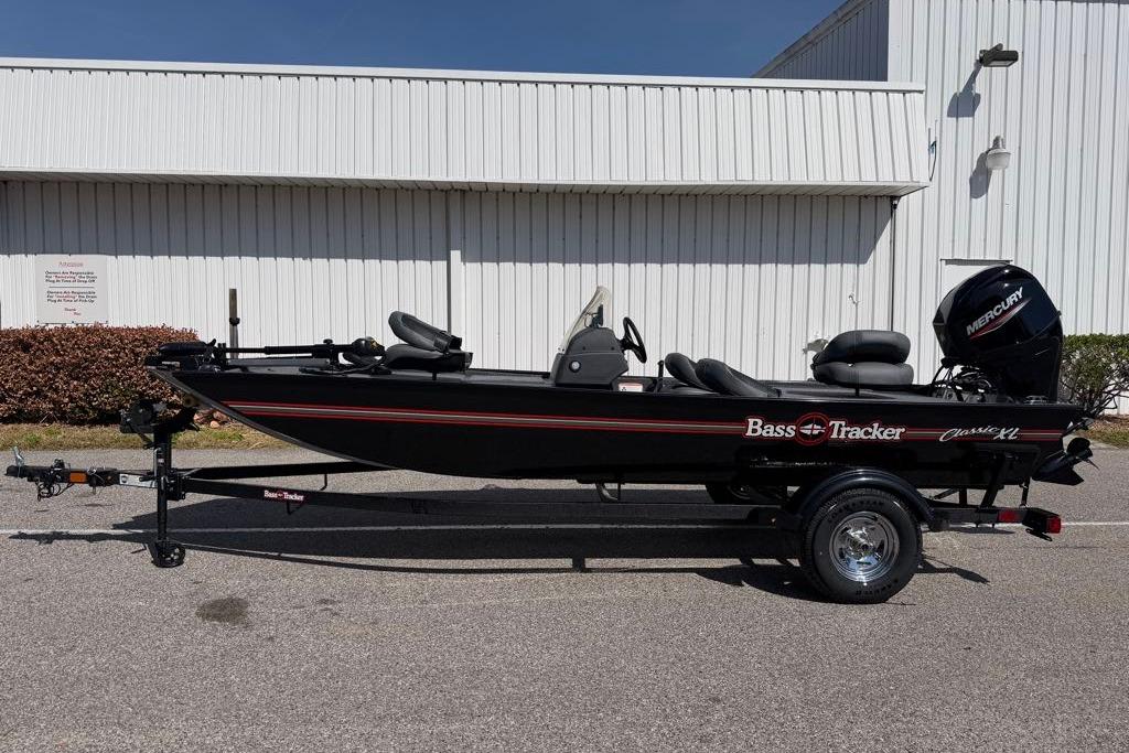2026 Tracker Bass Tracker Classic XL boat with Mercury engine, parked outdoors.